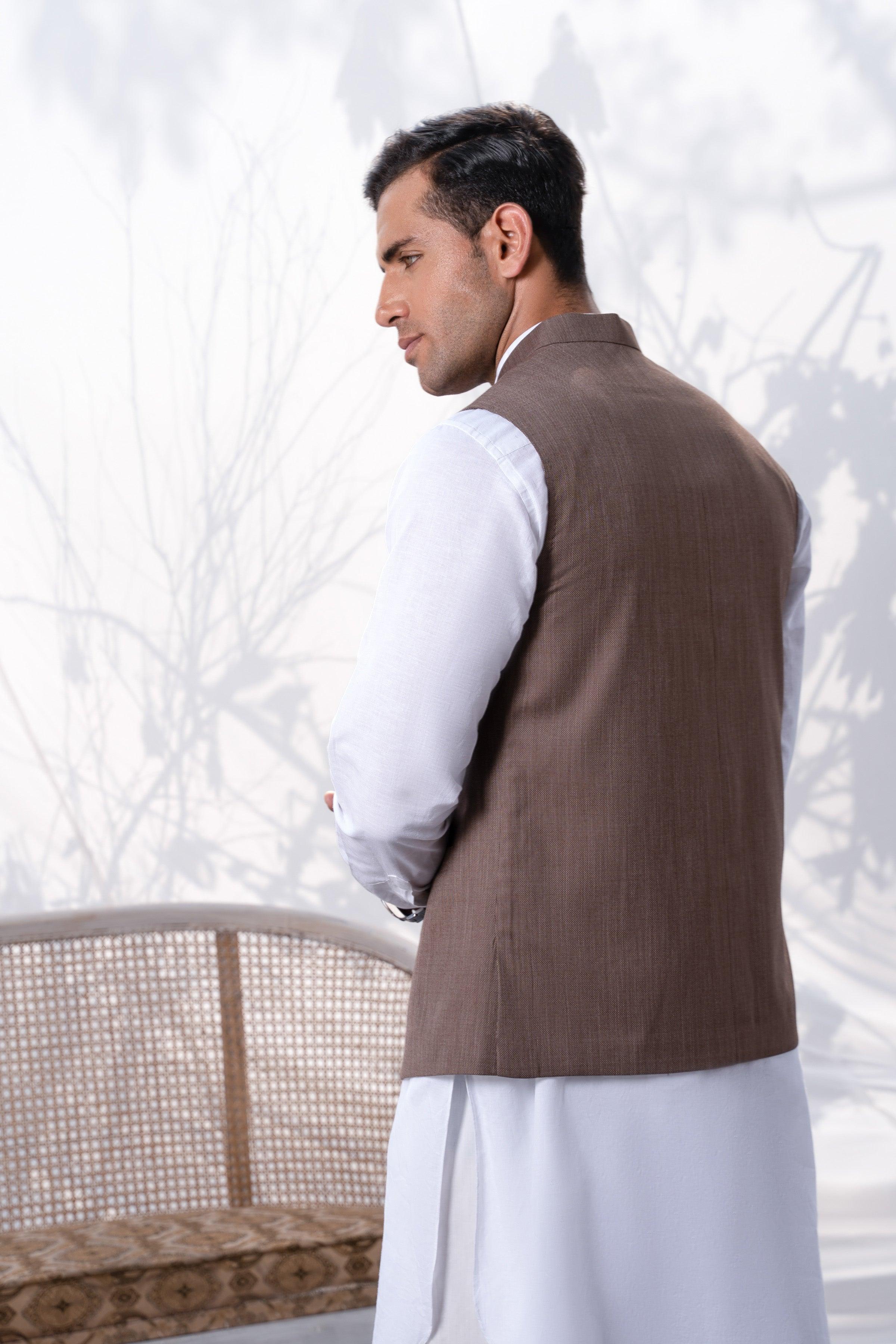 Brown waistcoat, side view over a white shirt