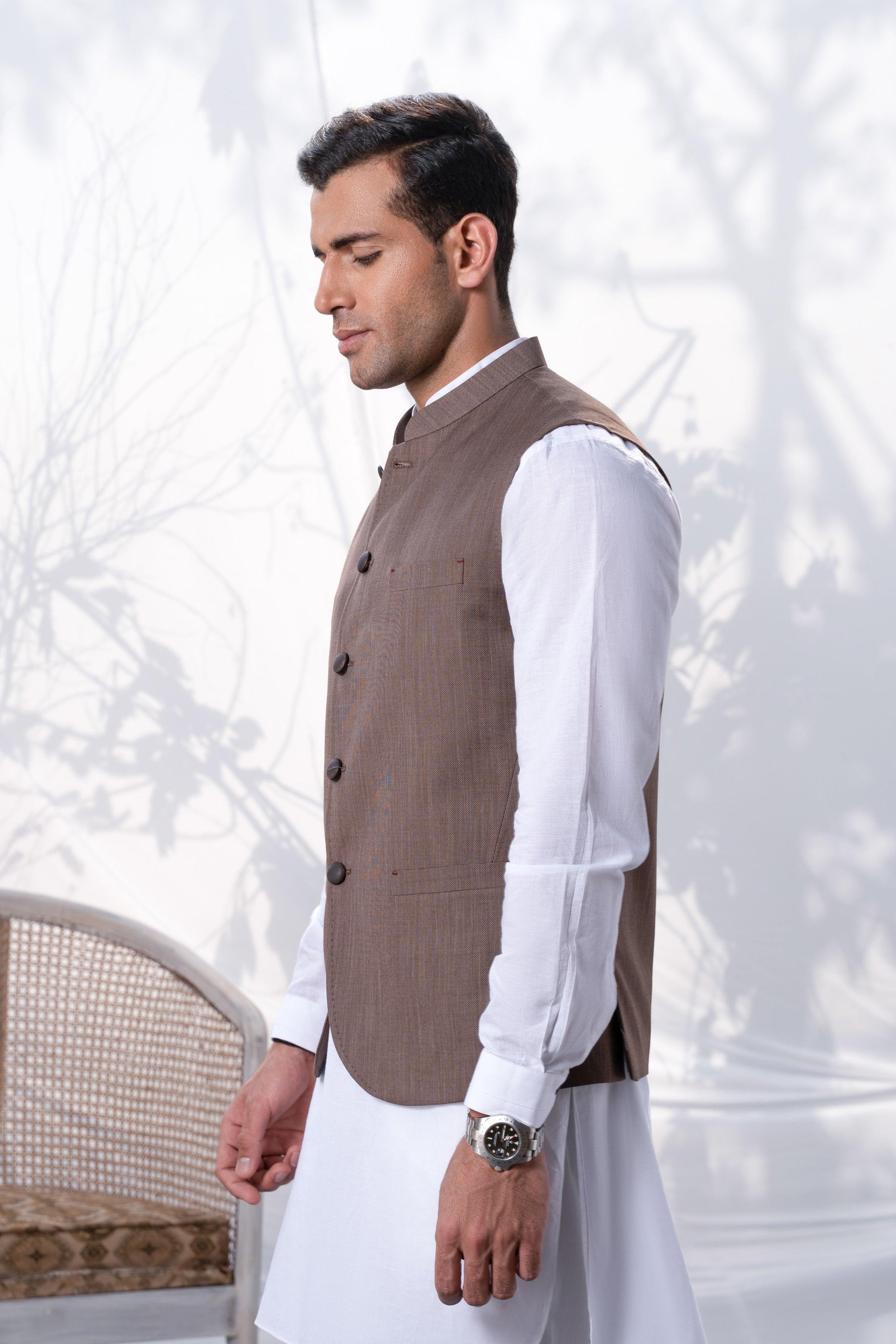 Brown waistcoat with four buttons and stand collar, side view over white shirt
