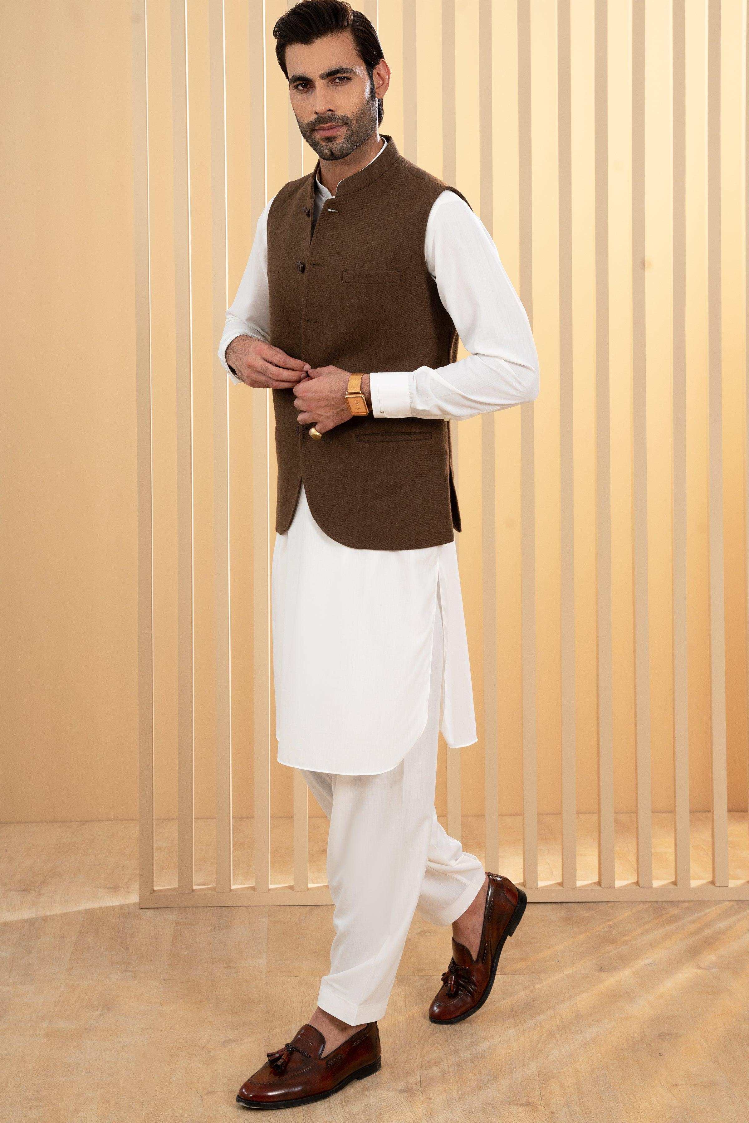 Dark olive waistcoat with button front and stand collar over white long sleeves