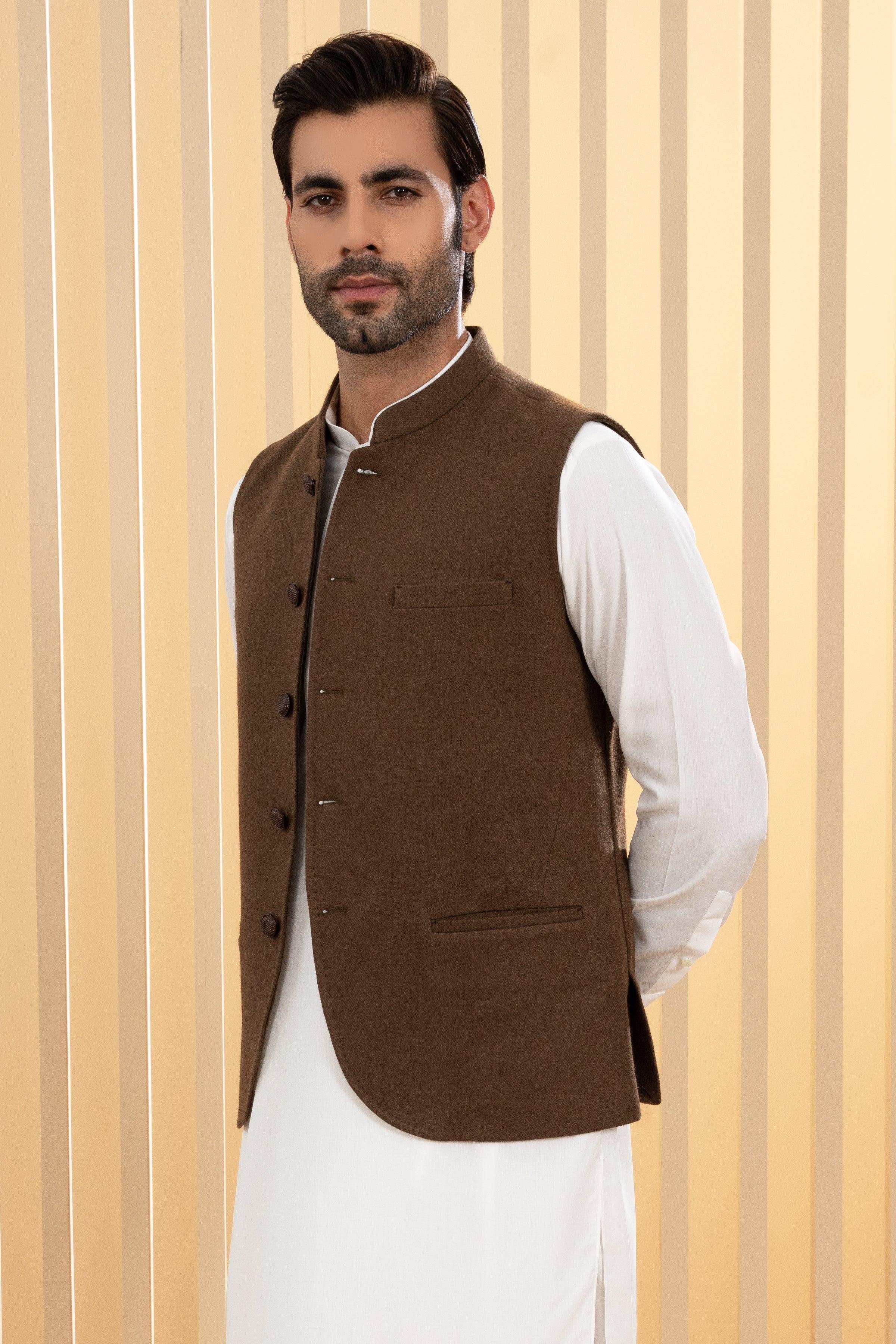 Dark olive waistcoat with button placket and chest pockets, worn with white shirt