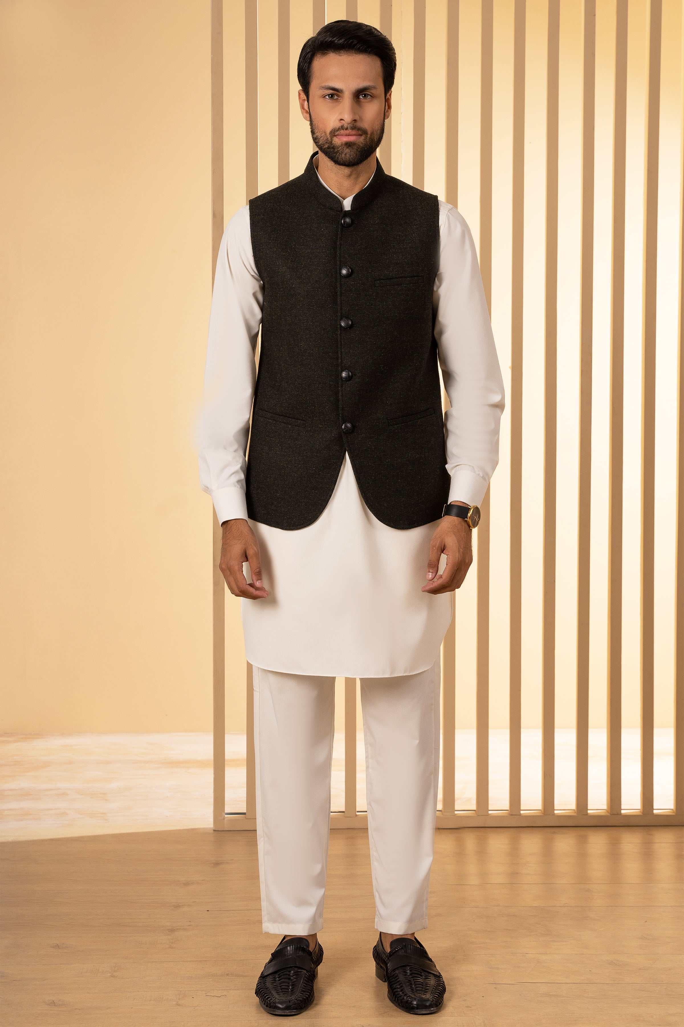 Mens dark green waistcoat with button-front, two pockets, worn over white shirt