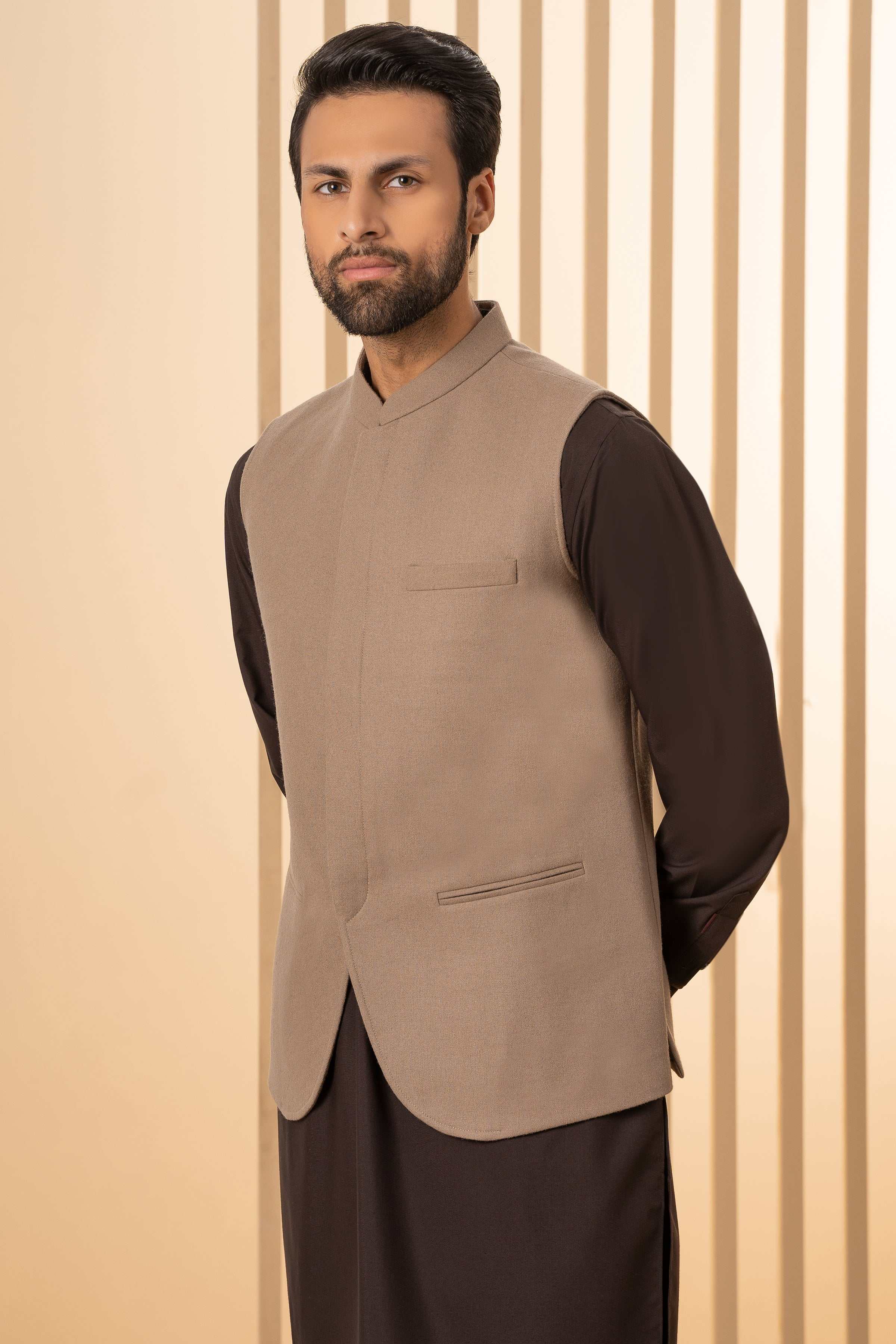 Khaki waistcoat with chest pocket and front opening, side view