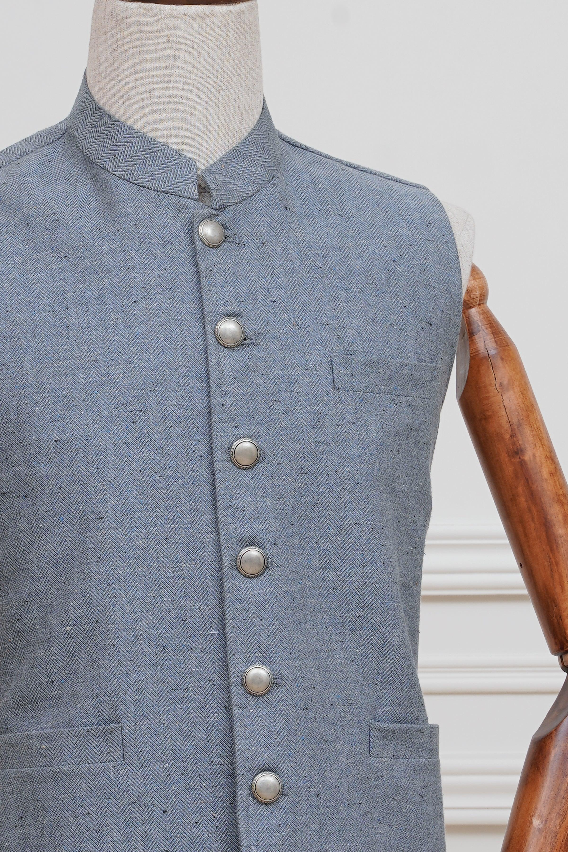 Light blue waistcoat close-up of stand collar and silver buttons