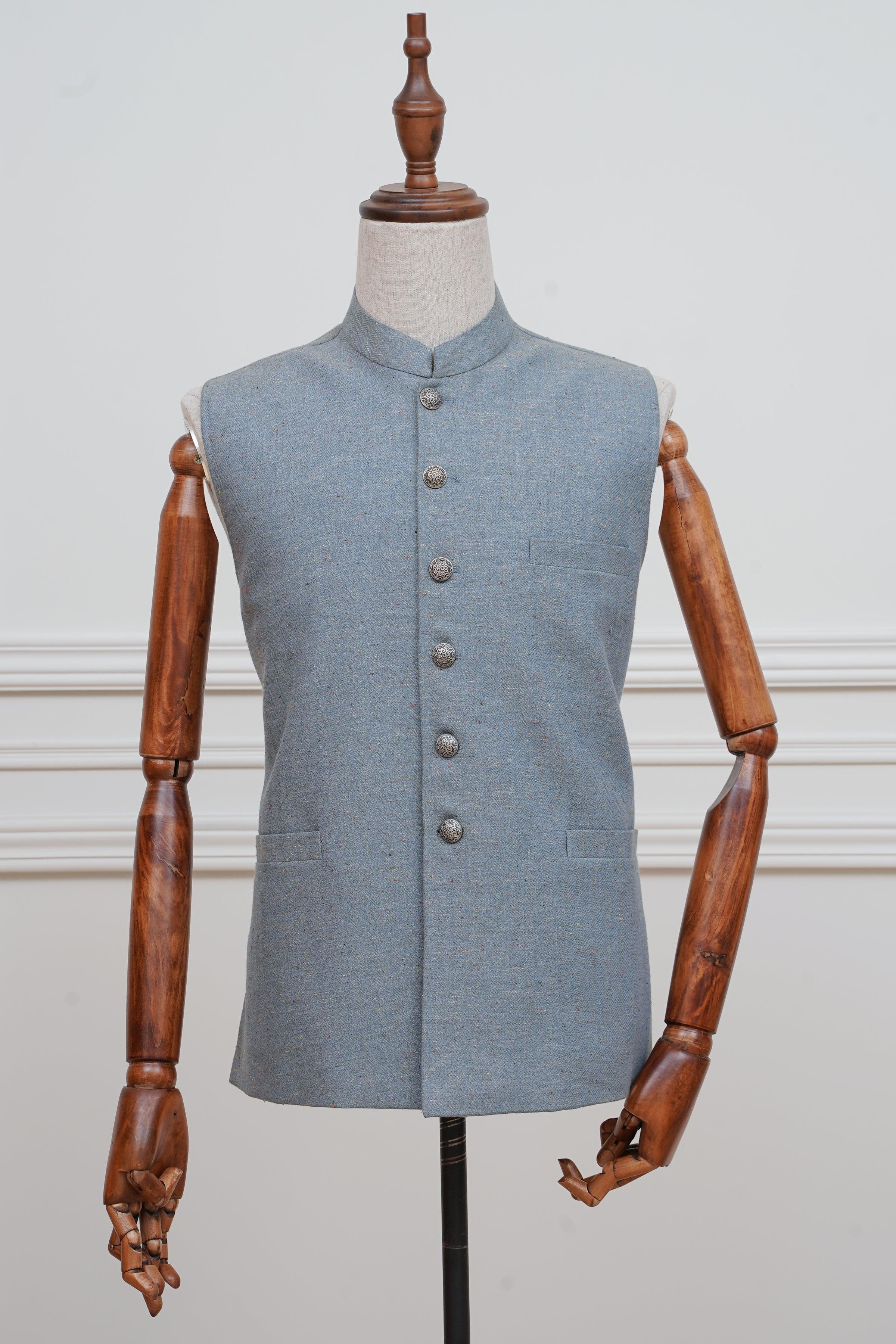 Light blue waistcoat with high collar, front button placket, and chest pocket.
