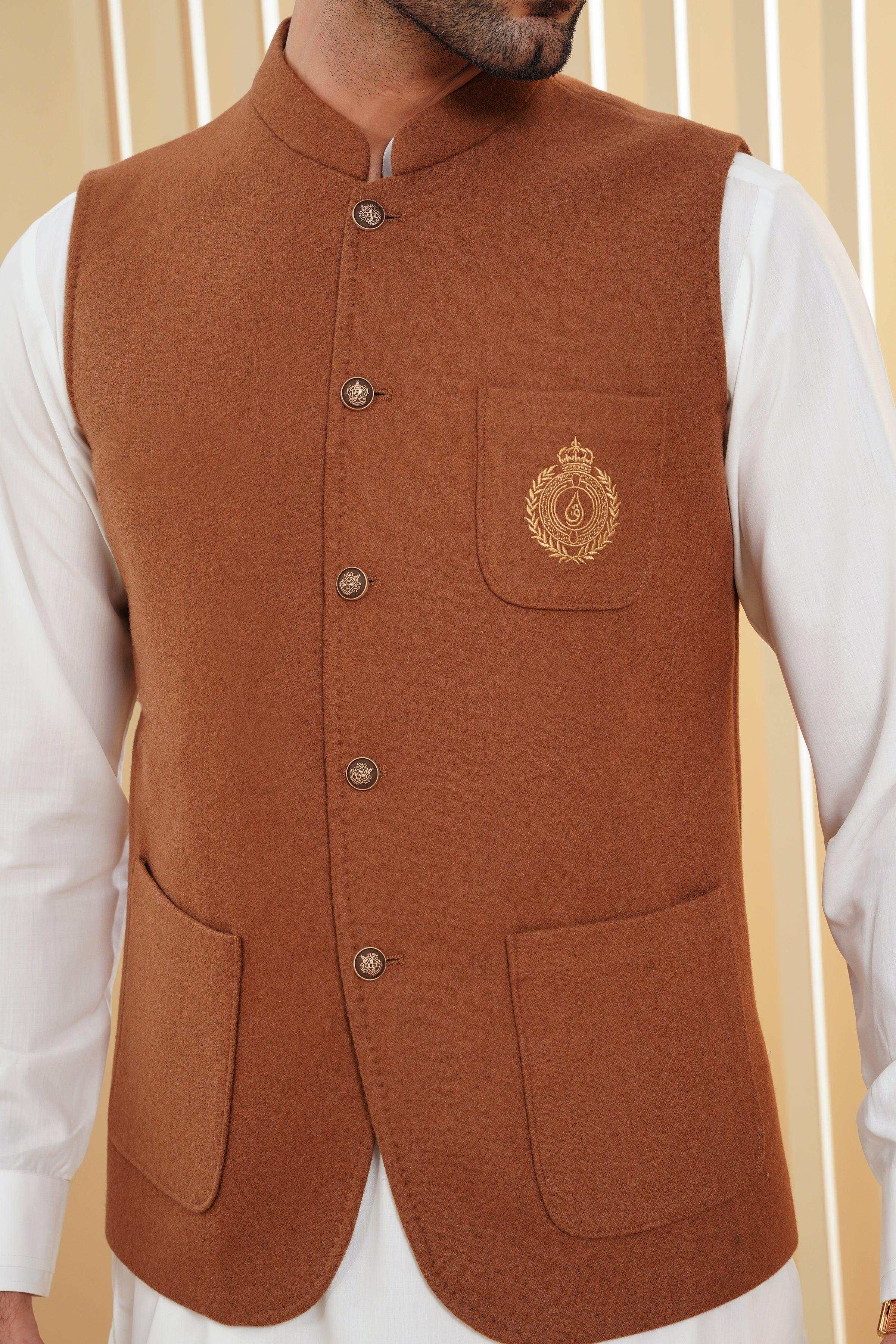 Brown waistcoat vest close-up of buttons and chest pocket with crest