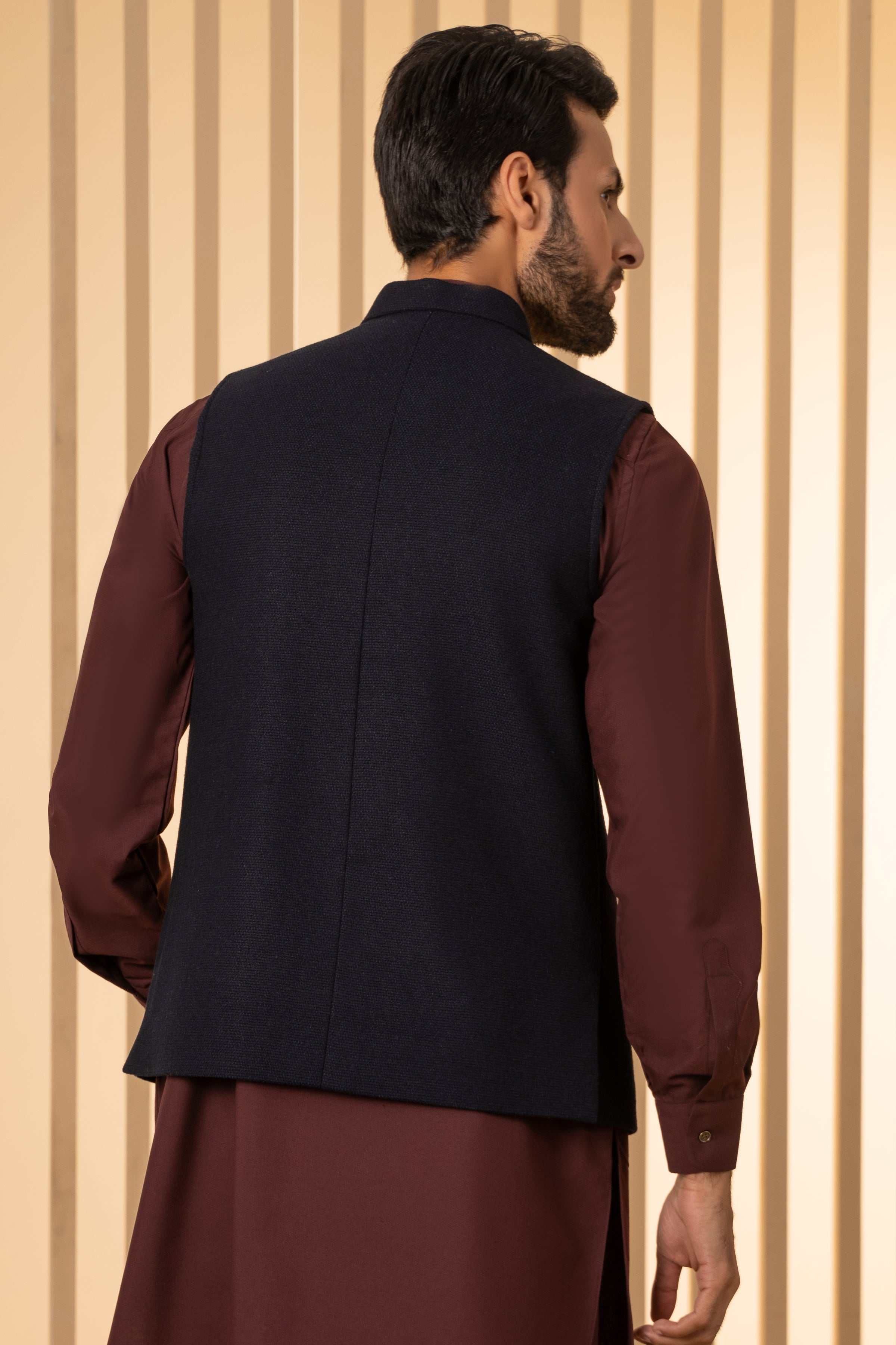 Men's dark navy waistcoat back view, sleeveless with center vent
