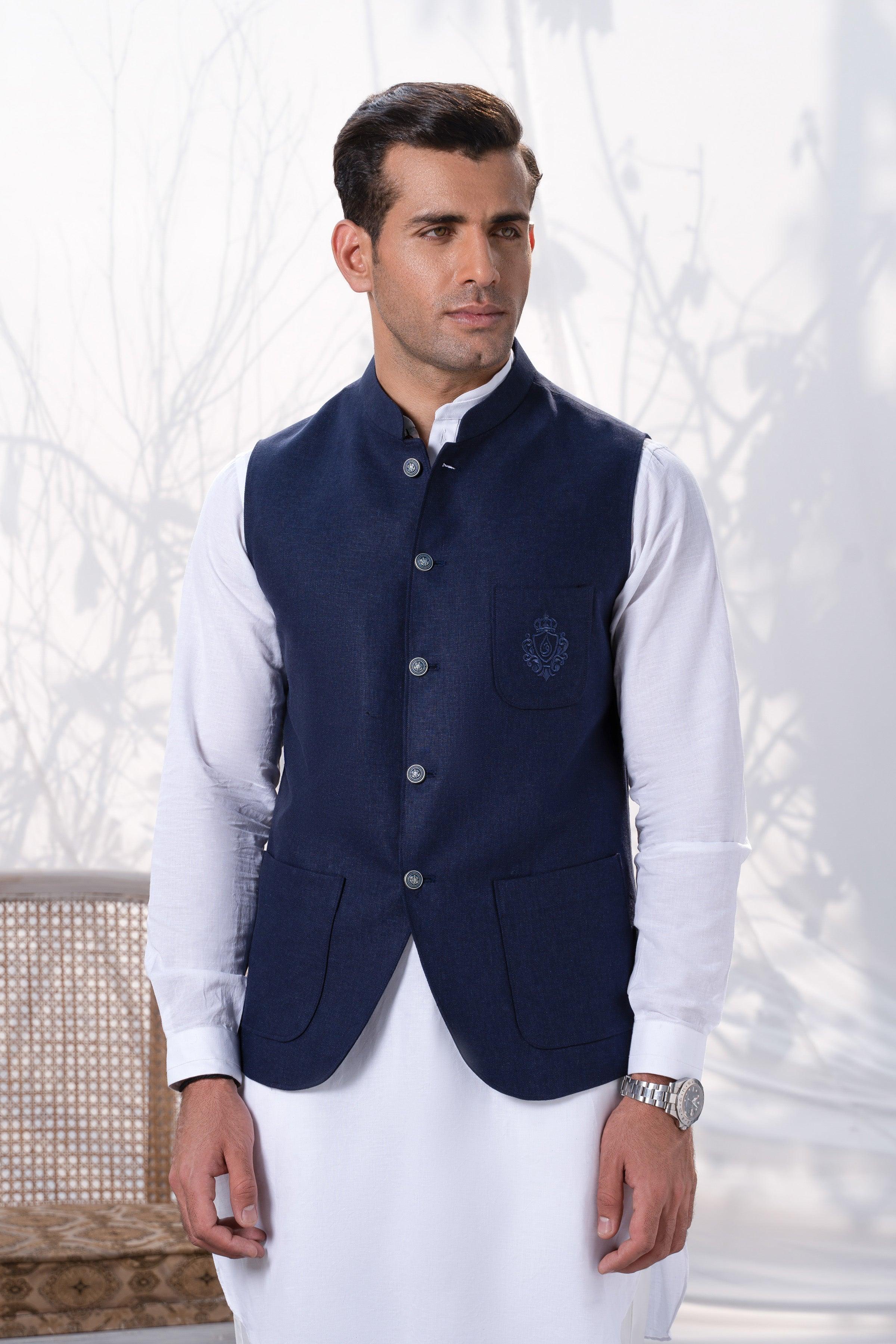 Navy waistcoat with button front and chest pocket, worn over a white shirt