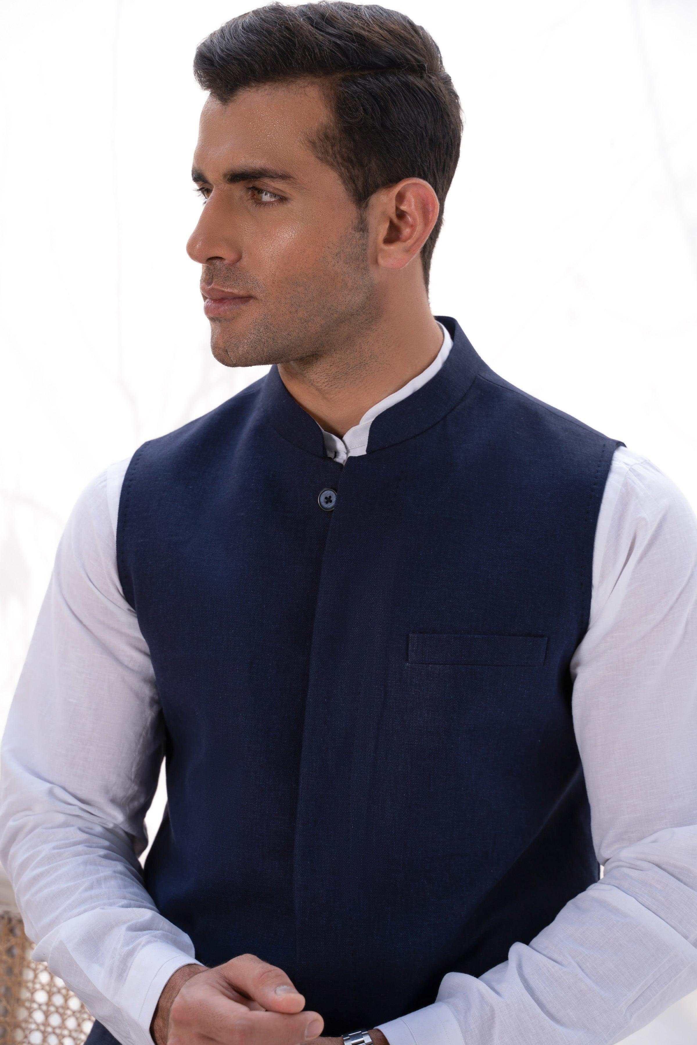Navy waistcoat close-up with stand collar, front button, and chest pocket