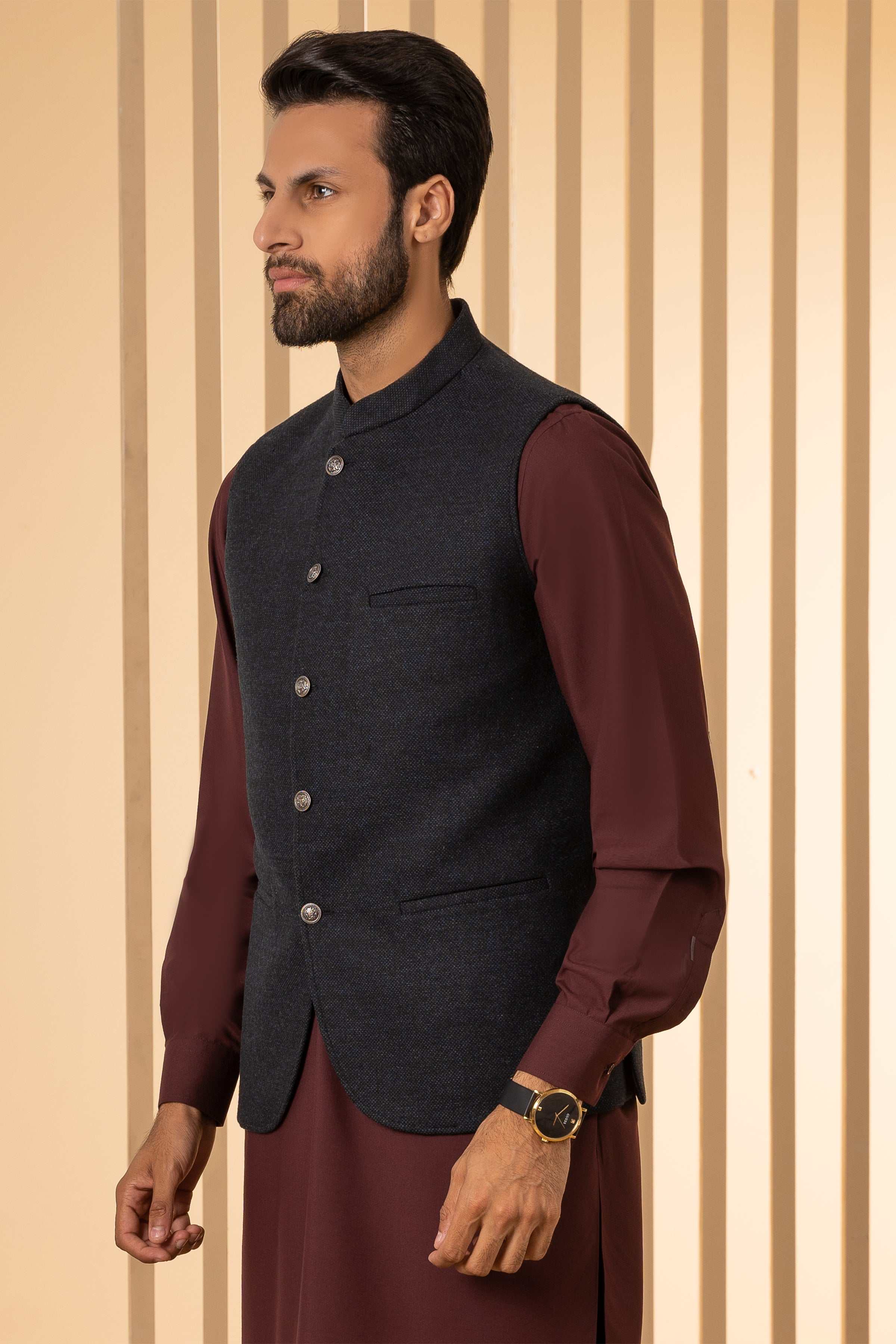 Navy waistcoat with stand collar, button front, and front welt pockets