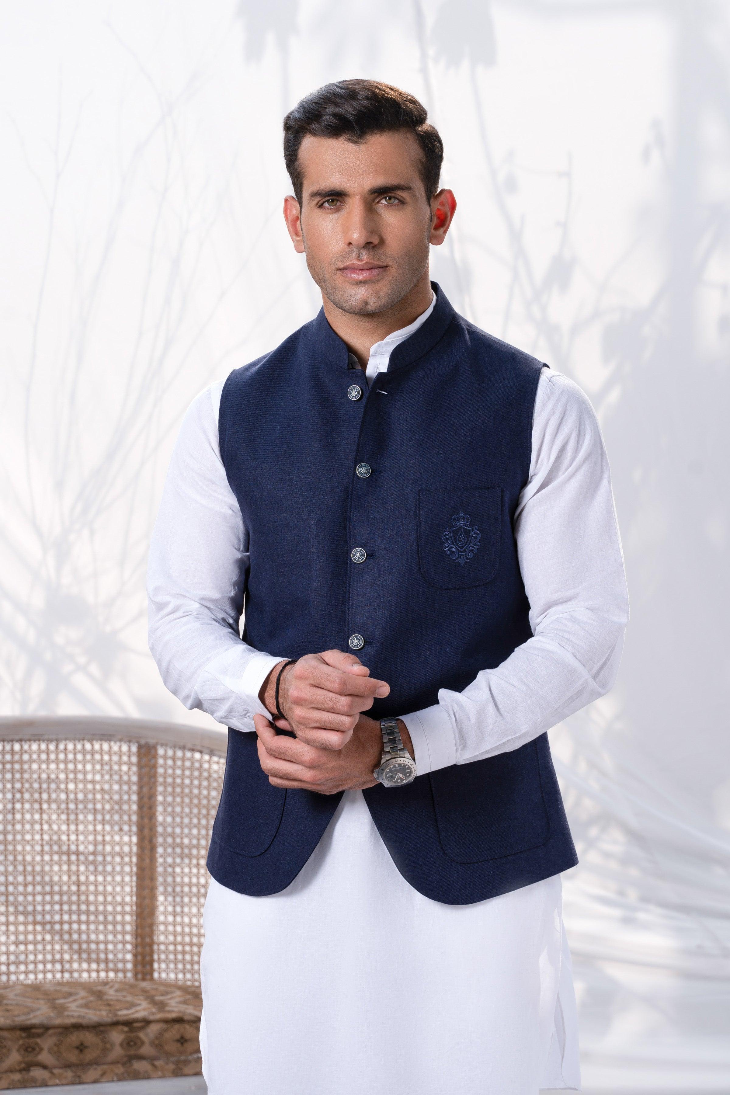 Navy waistcoat with stand collar and button placket, worn over a white shirt