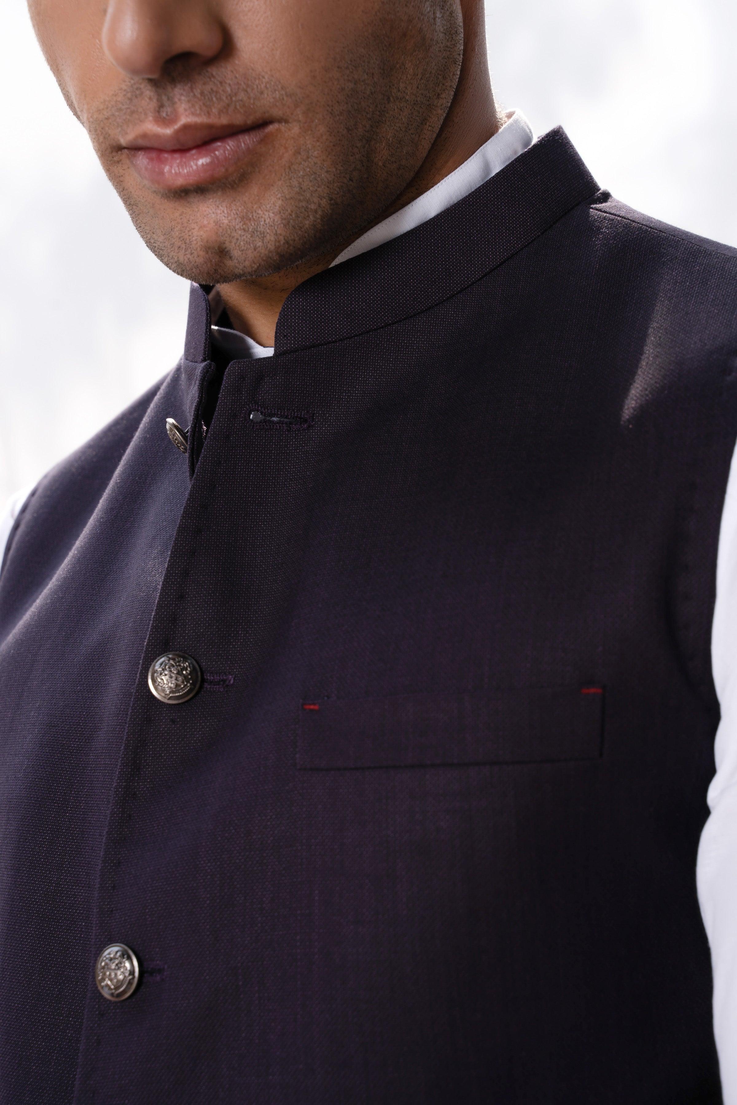 Plum waistcoat close-up with lapel, round buttons, and small chest pocket