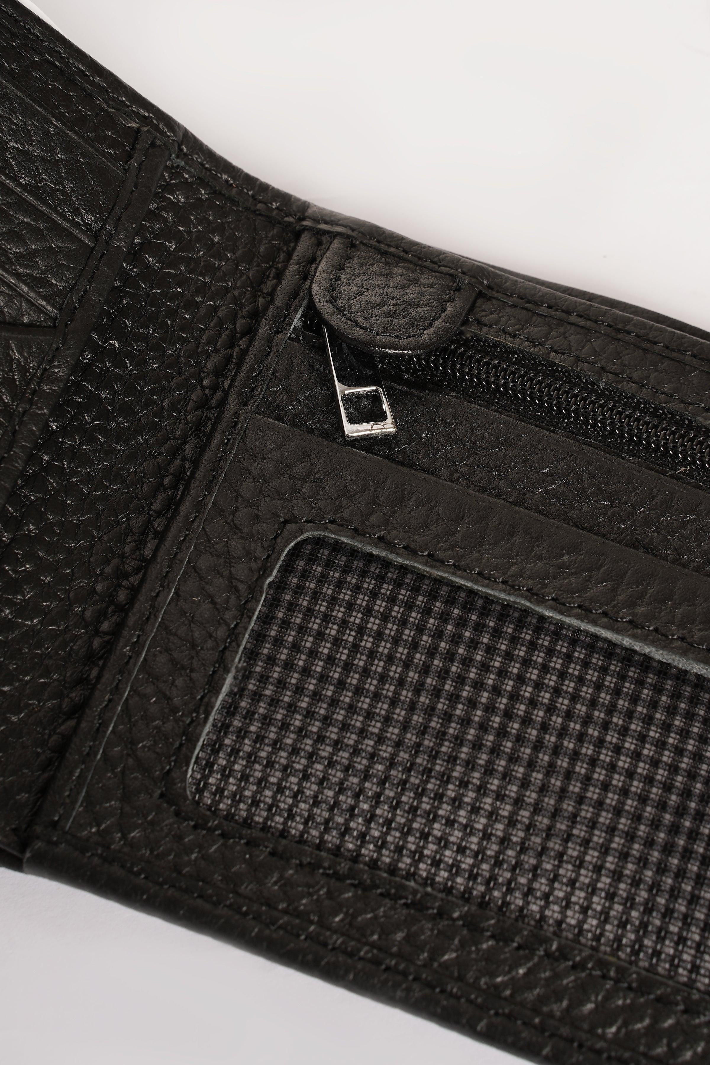 Black leather wallet close-up with zipper pocket and ID slot window.