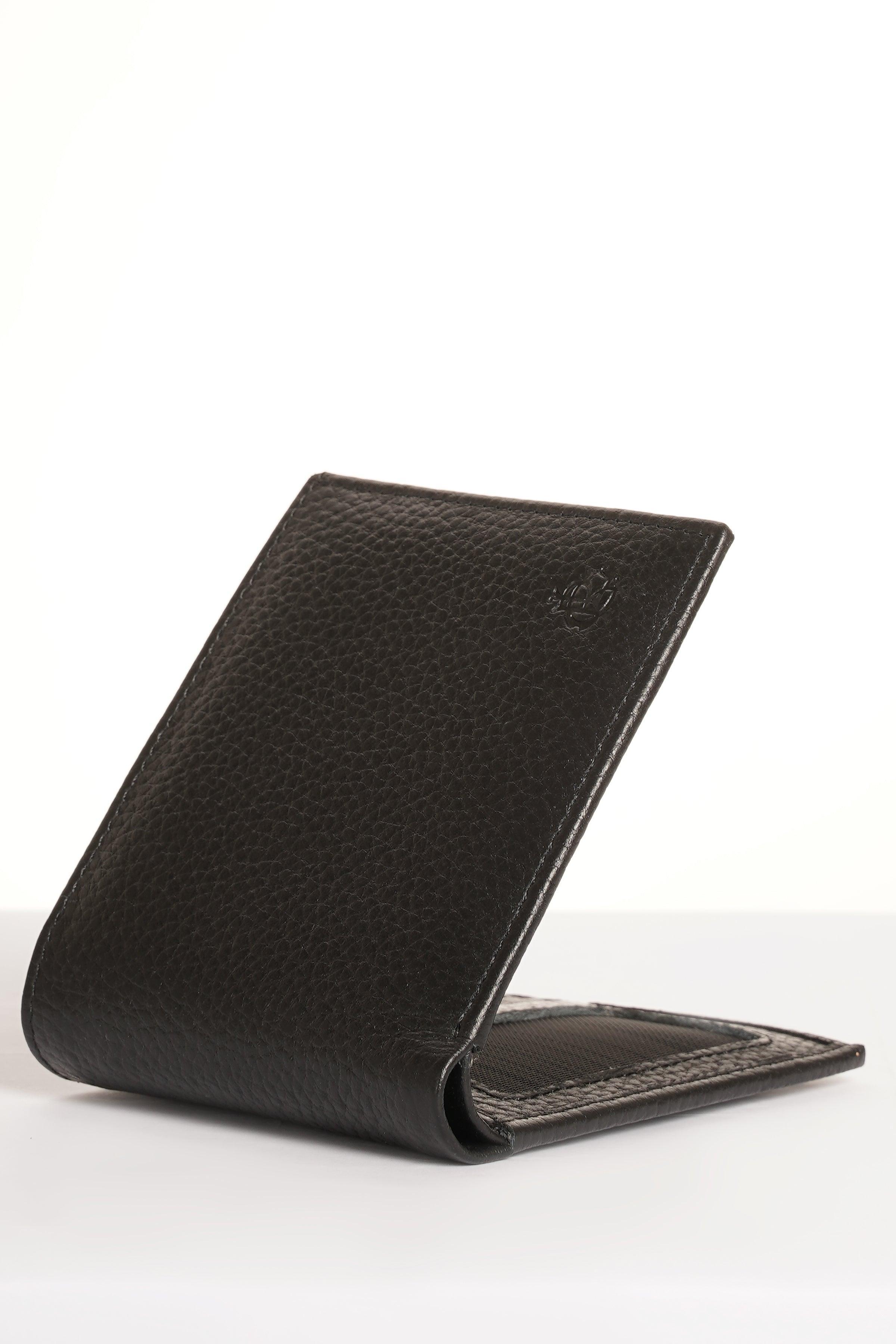 Black leather bi-fold wallet with snap closure, angled view.