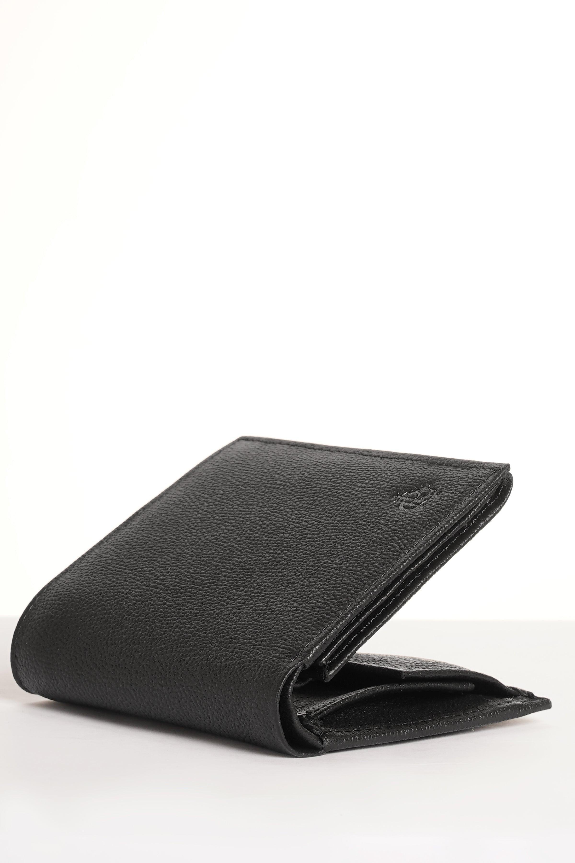 Black leather wallet with flap, angled profile