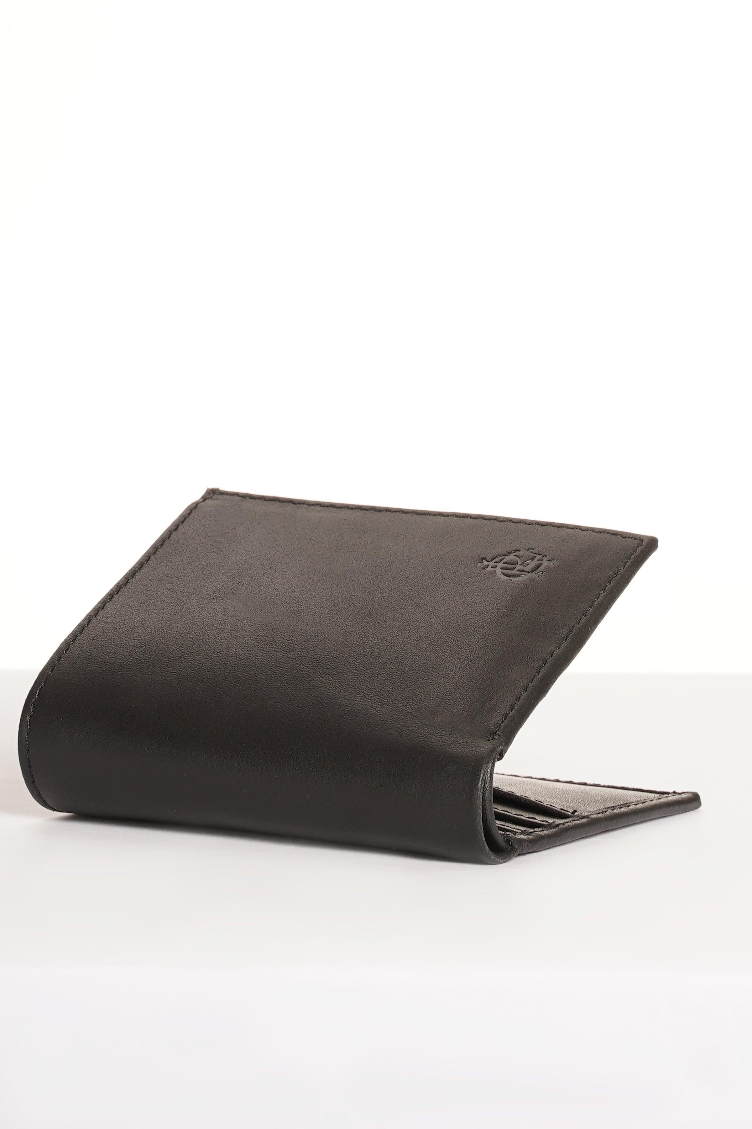 Black leather wallet, angled view with folded front and visible interior