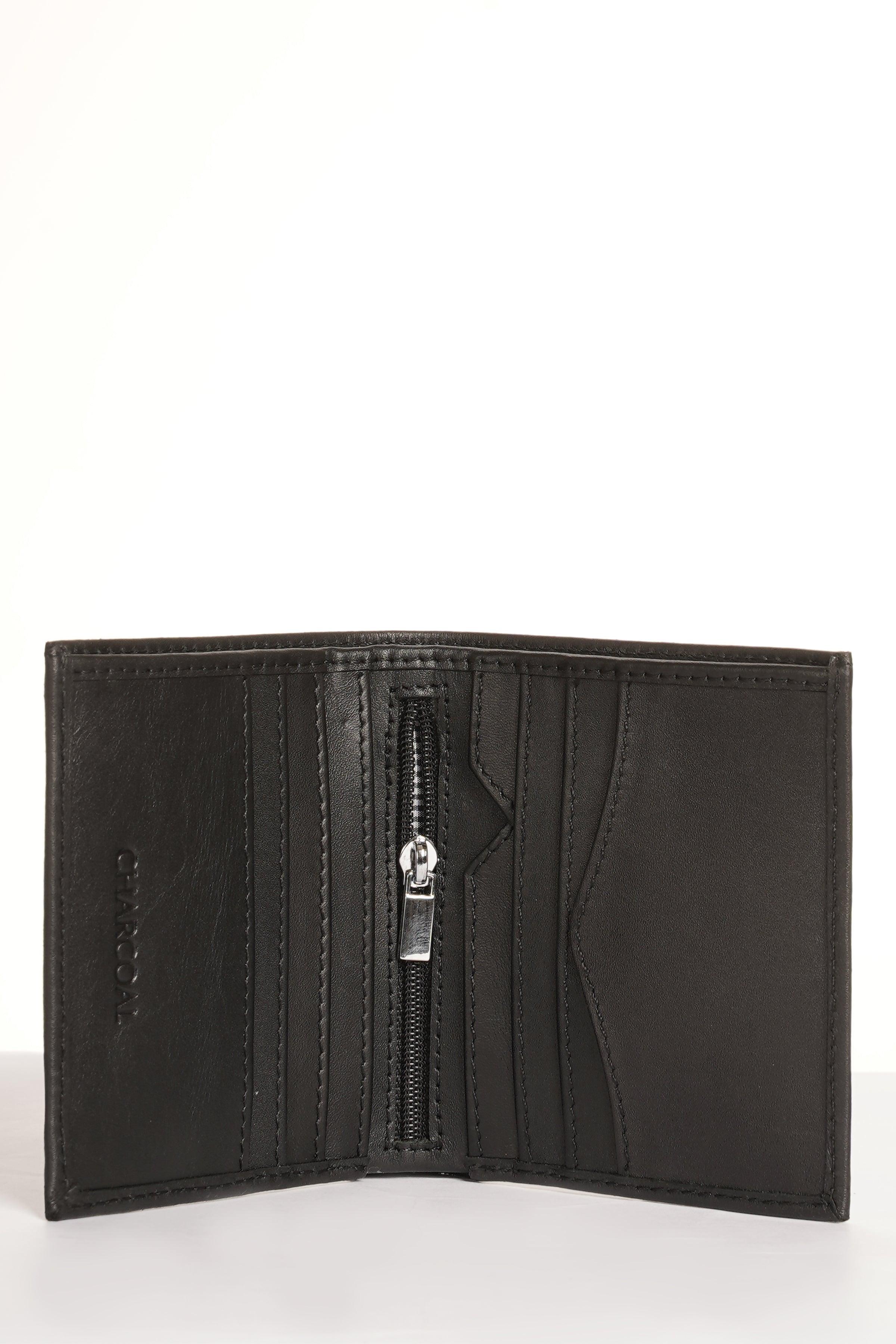 Black leather bi-fold wallet opened, showing central zipper pocket