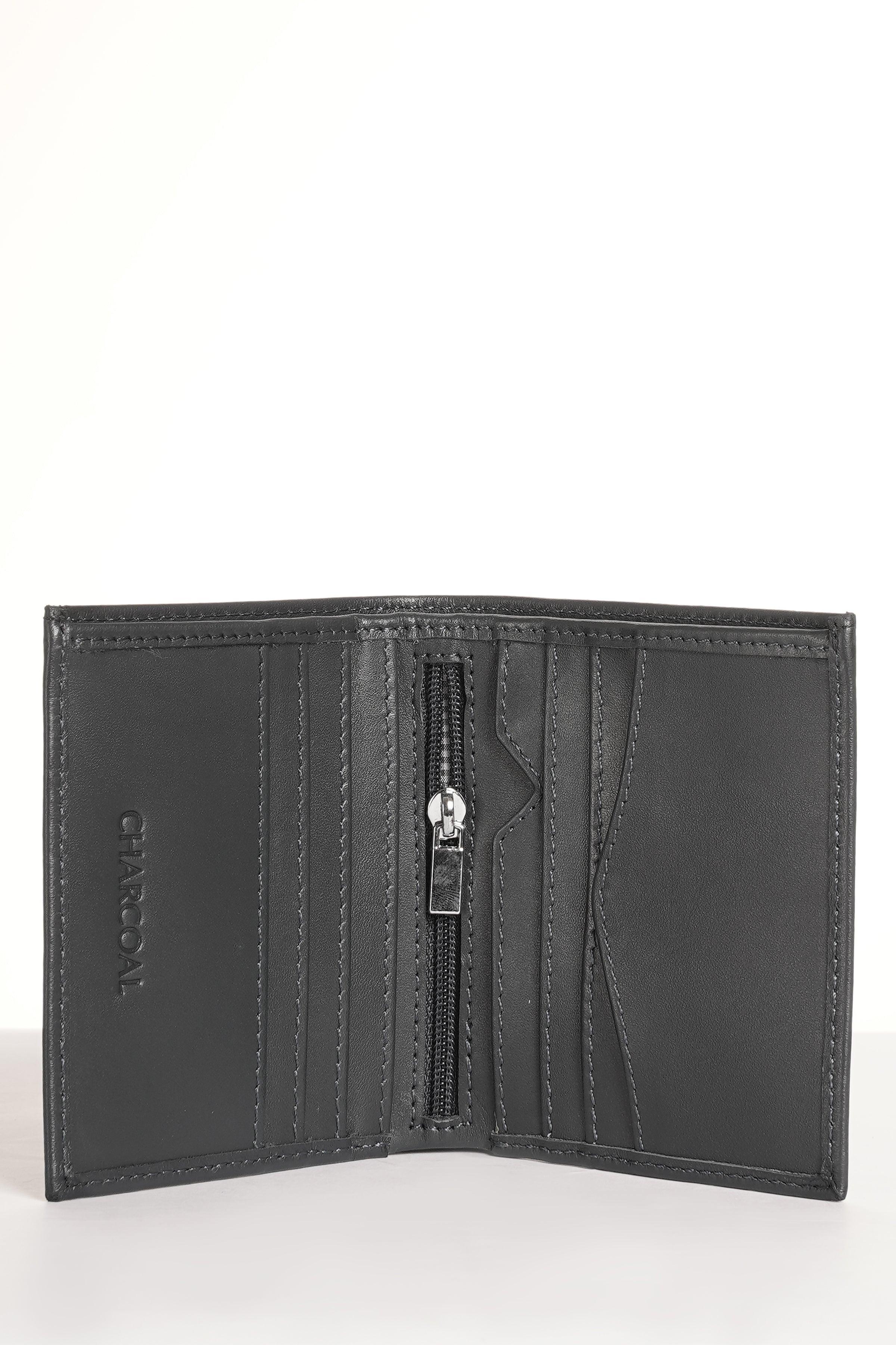 Dark leather bifold wallet interior with multiple card compartments and zipper.