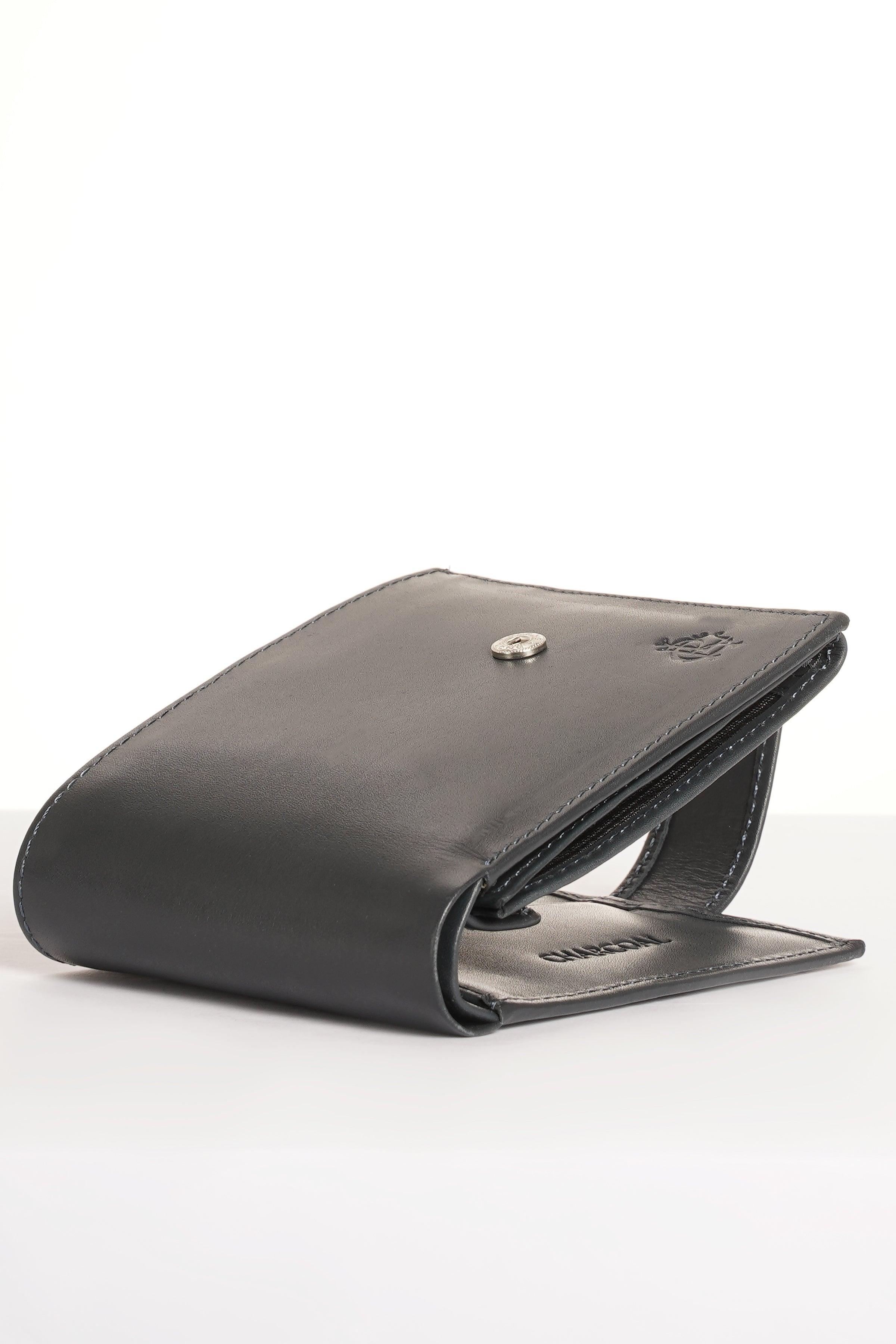 Dark leather wallet opened, showing interior card slots