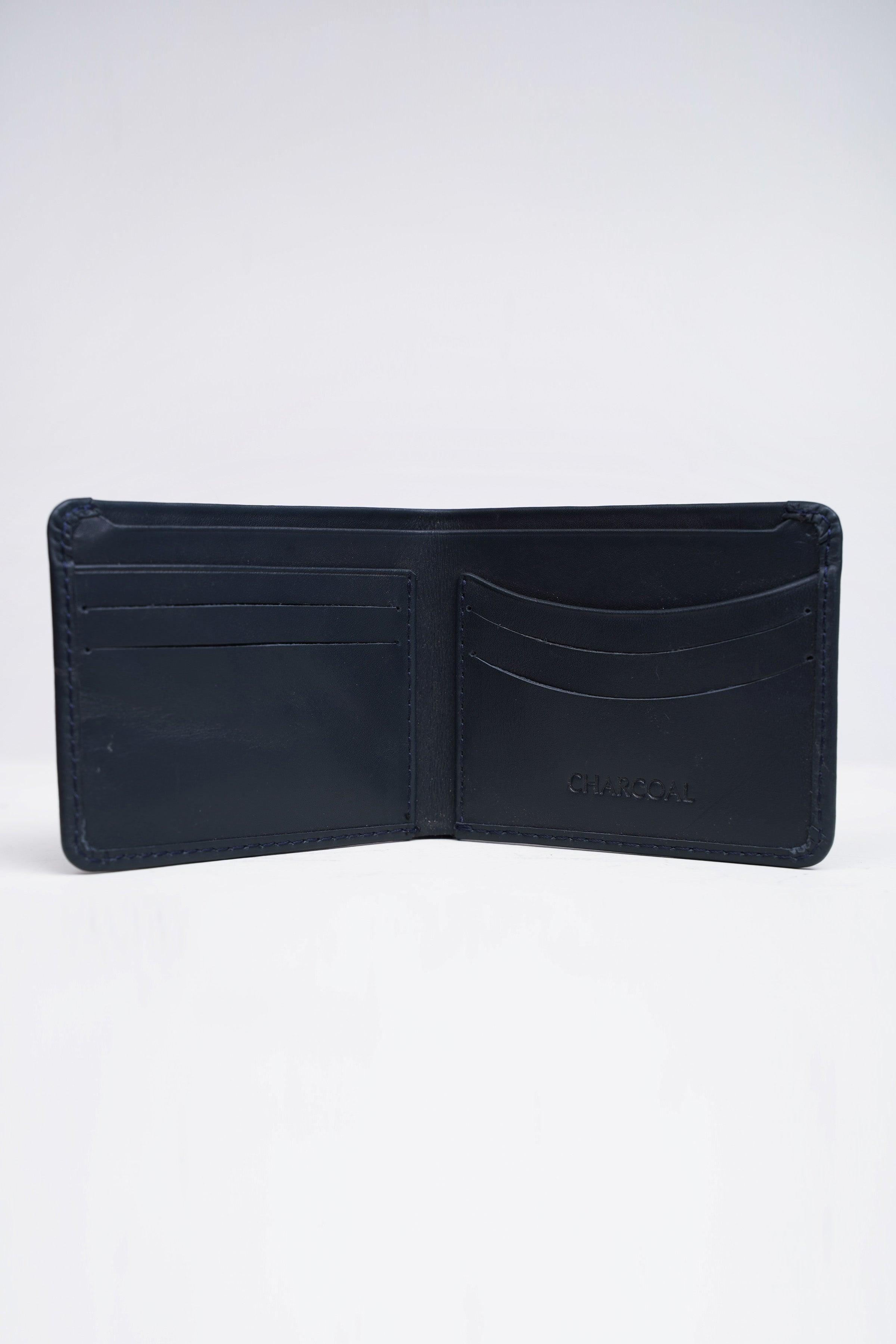 Dark blue bifold wallet open to show card slots and center divider