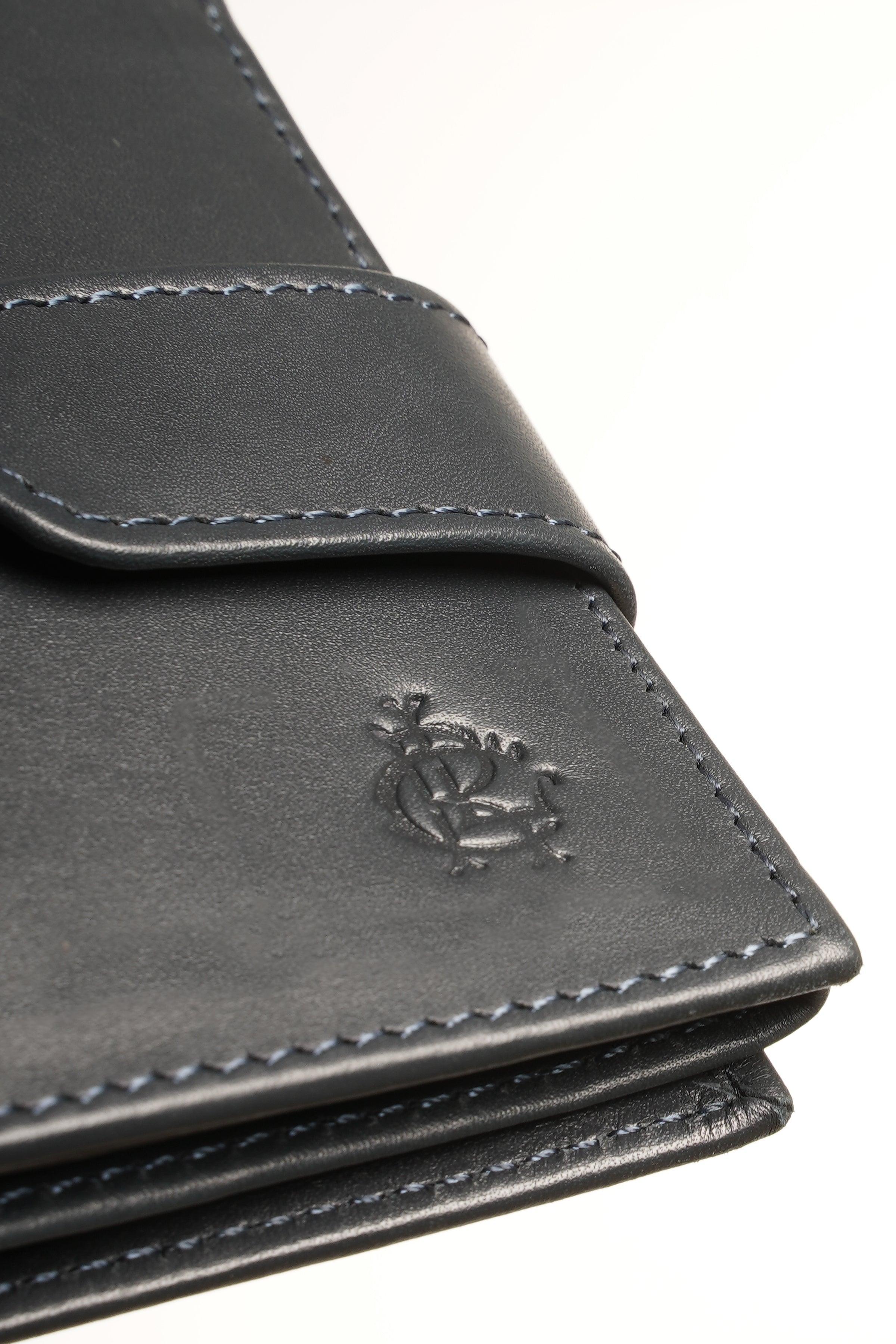 Dark leather wallet logo detail with contrast stitching