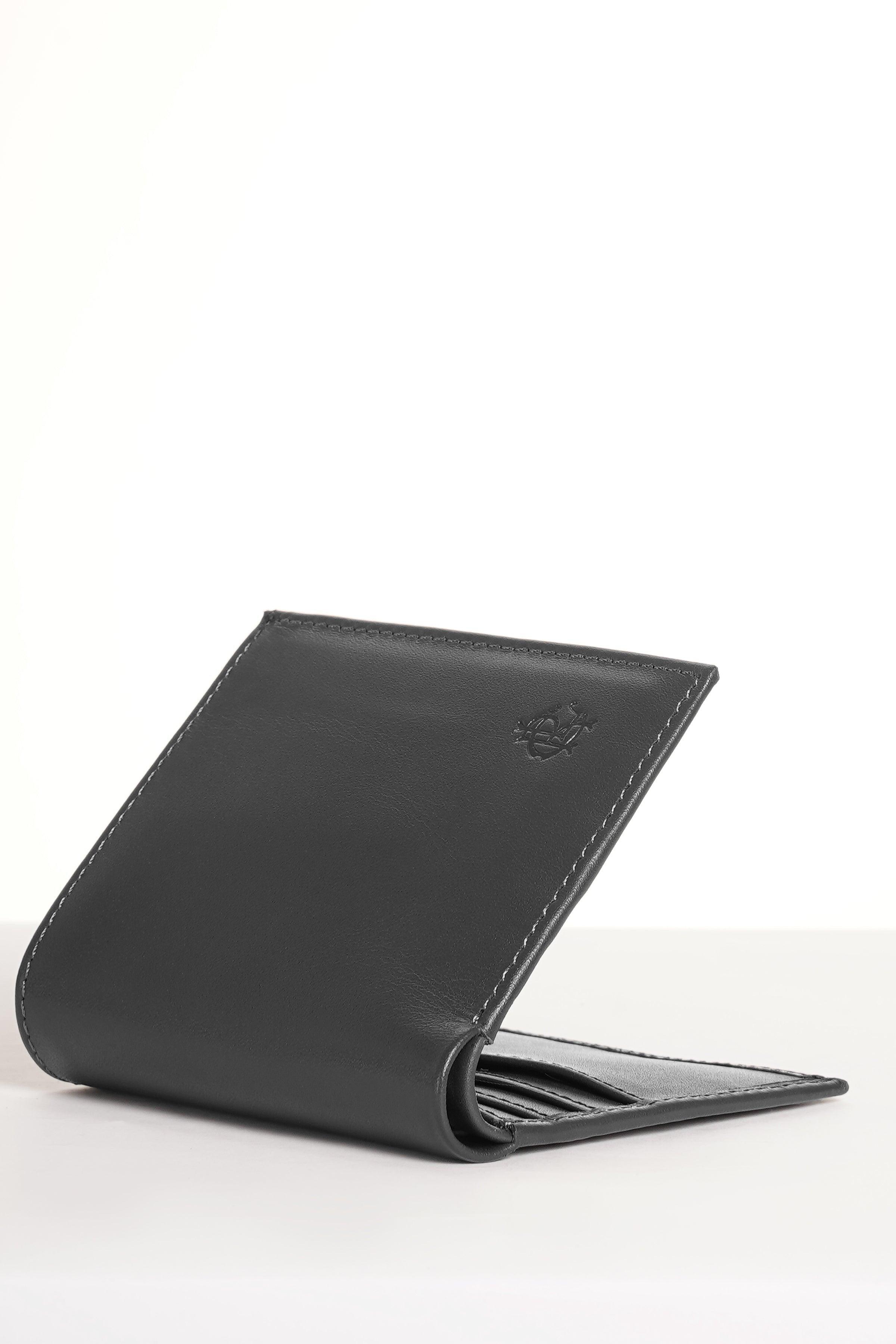 Dark leather bifold wallet partially open, showing card slots and interior.