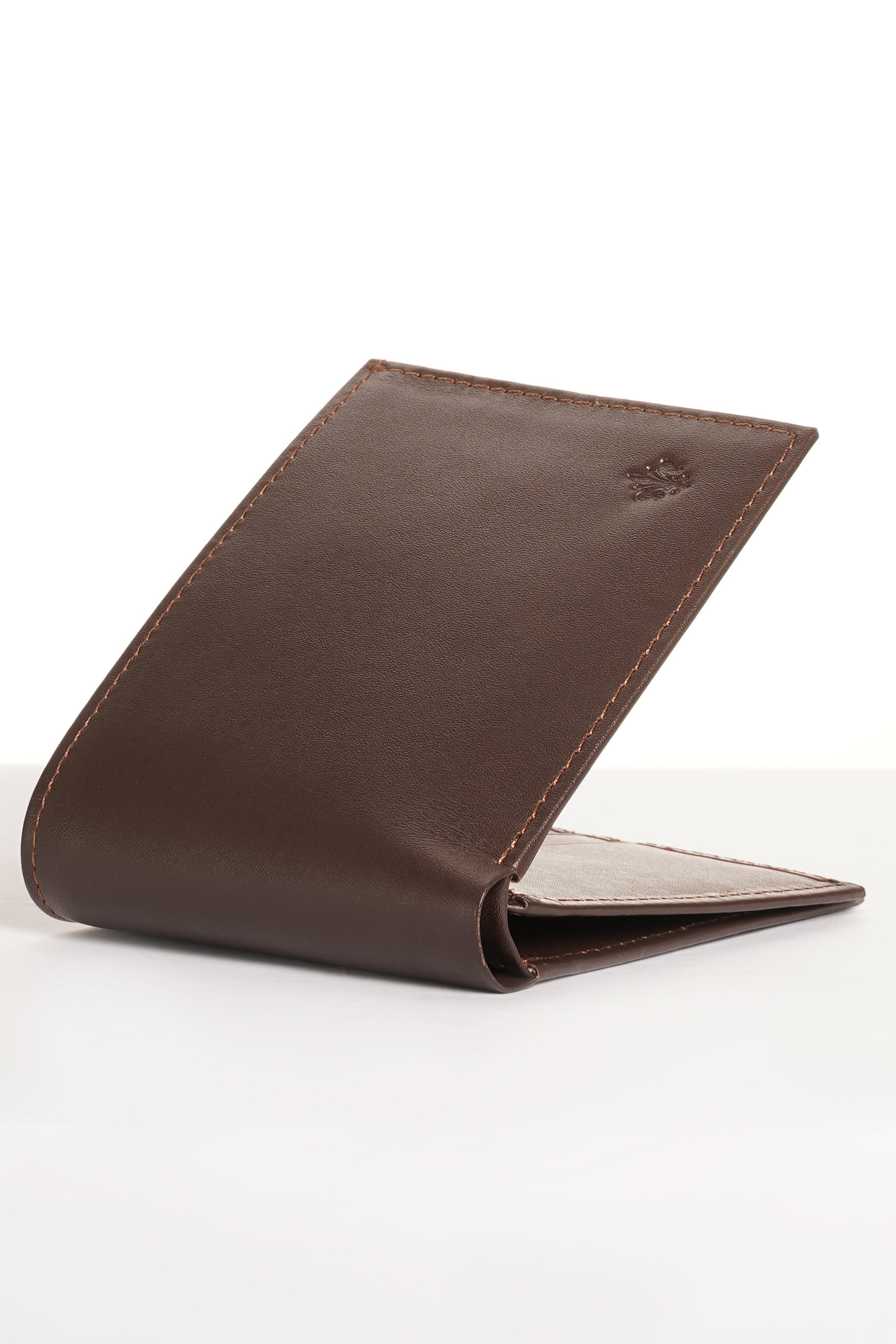 Brown leather wallet opened with one card pocket and cash compartment visible