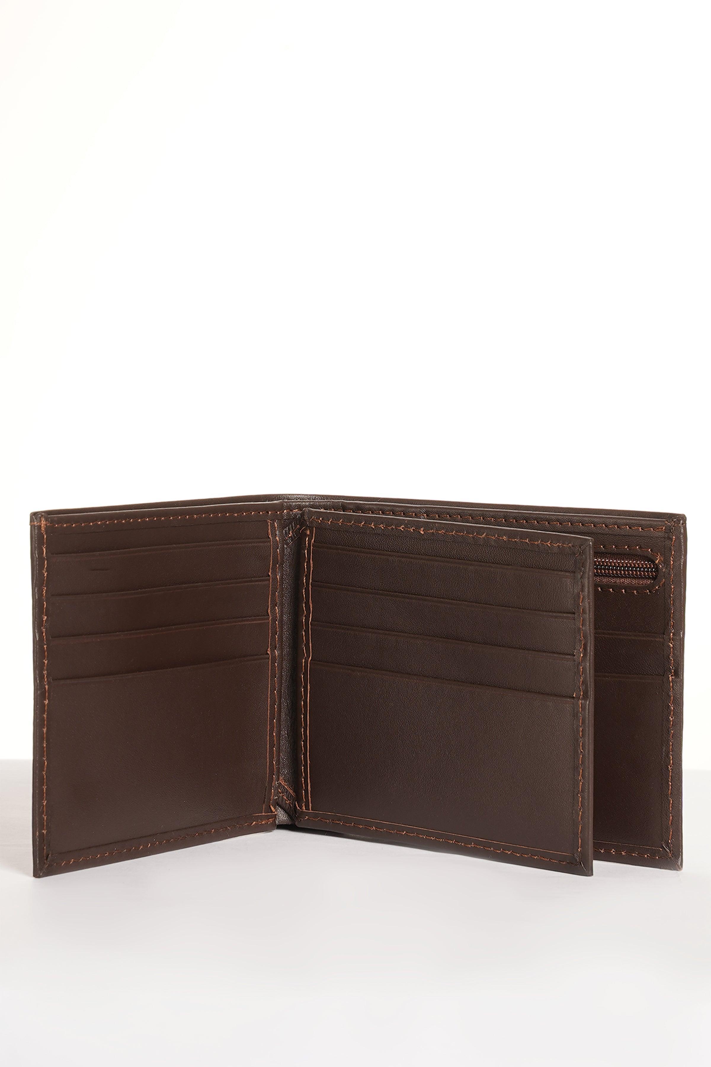 Brown leather wallet open with card compartments and central bill section