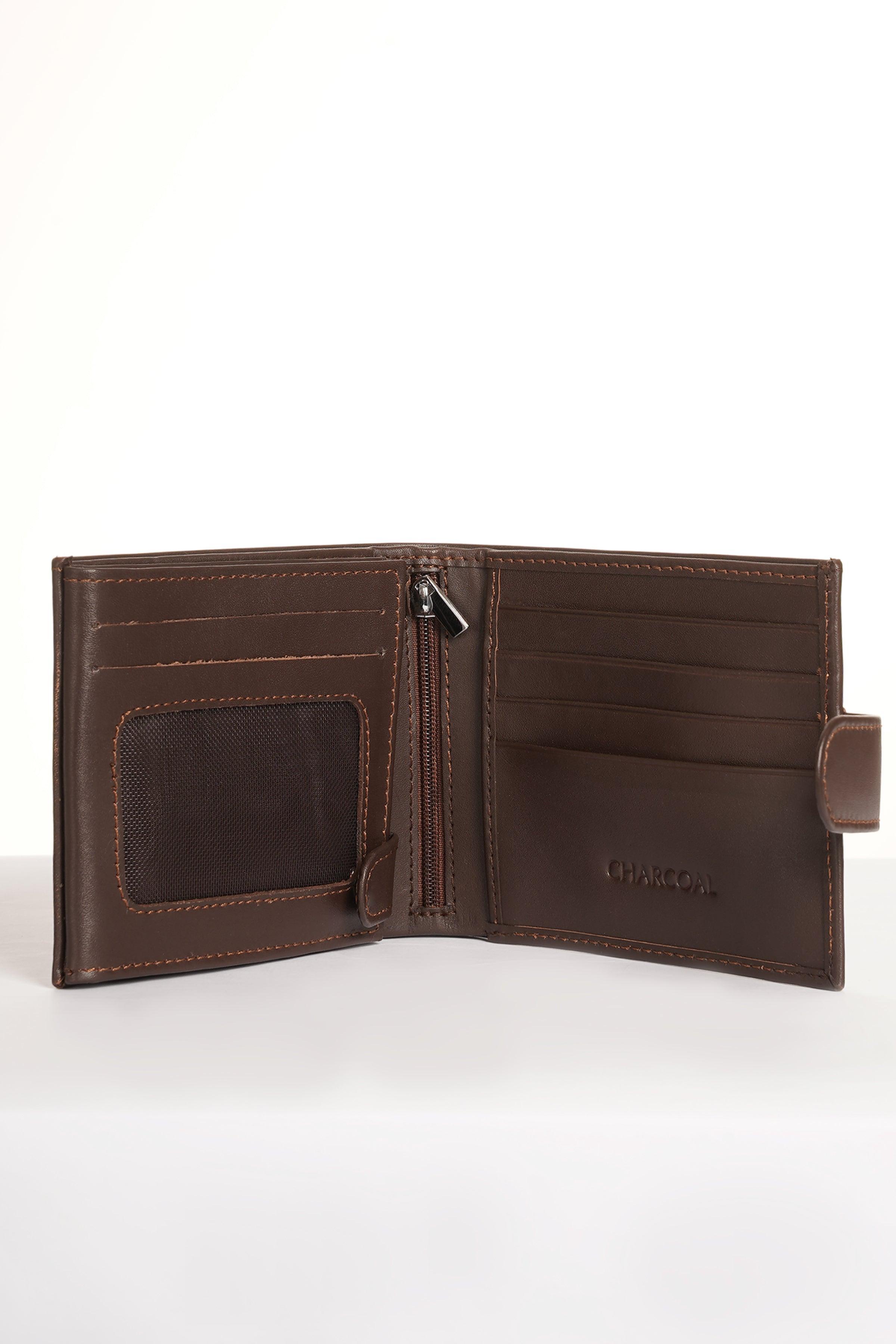 Brown leather bifold wallet open, showing card slots and inner compartments