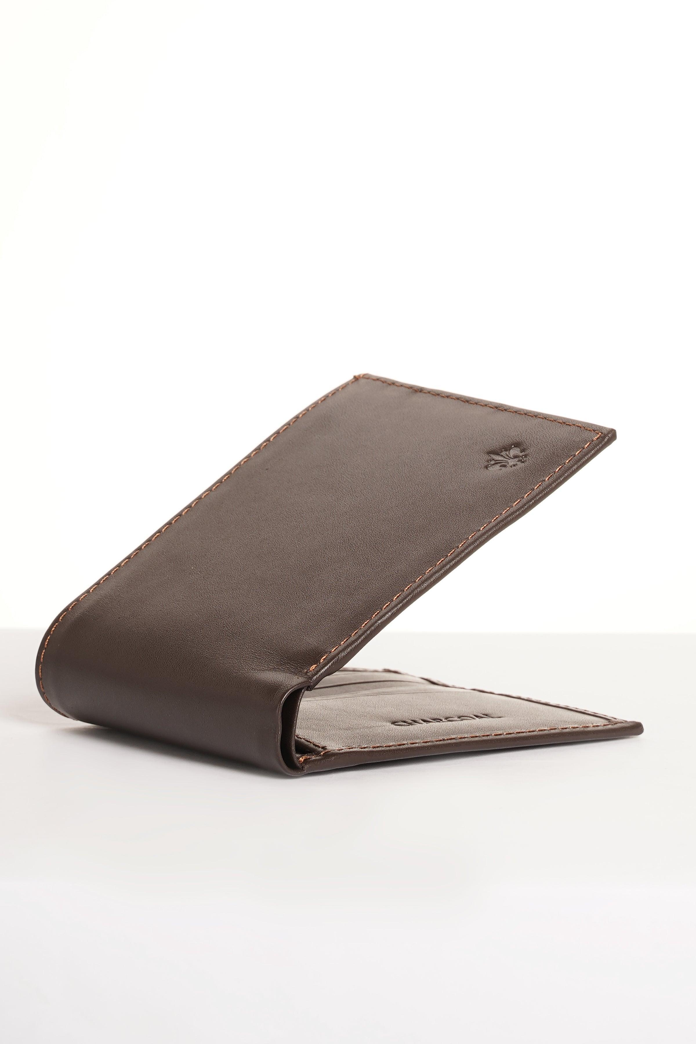 Brown leather bifold wallet with folded corner view and embossed logo