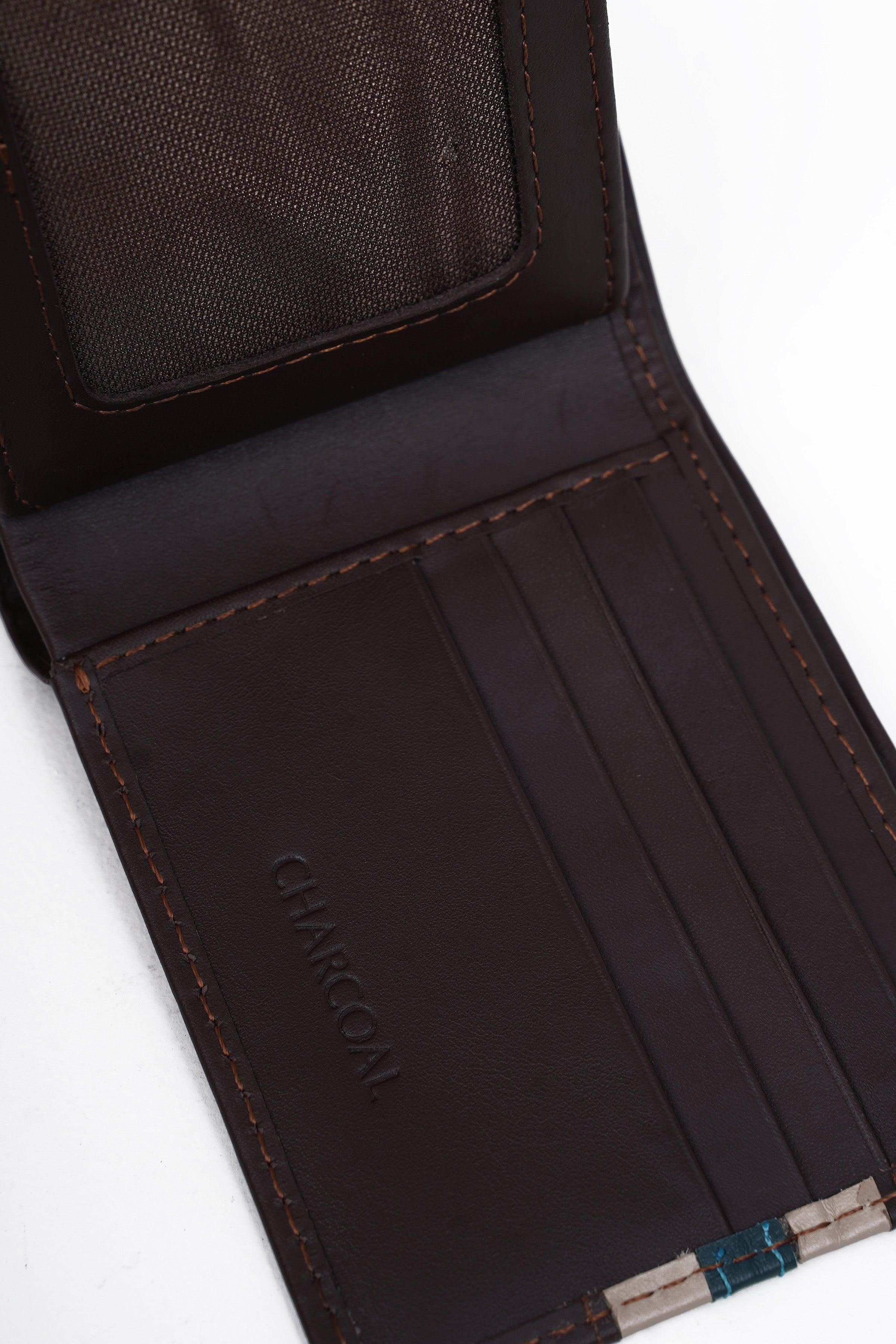 Brown wallet interior with card slots and logo stamp near bottom