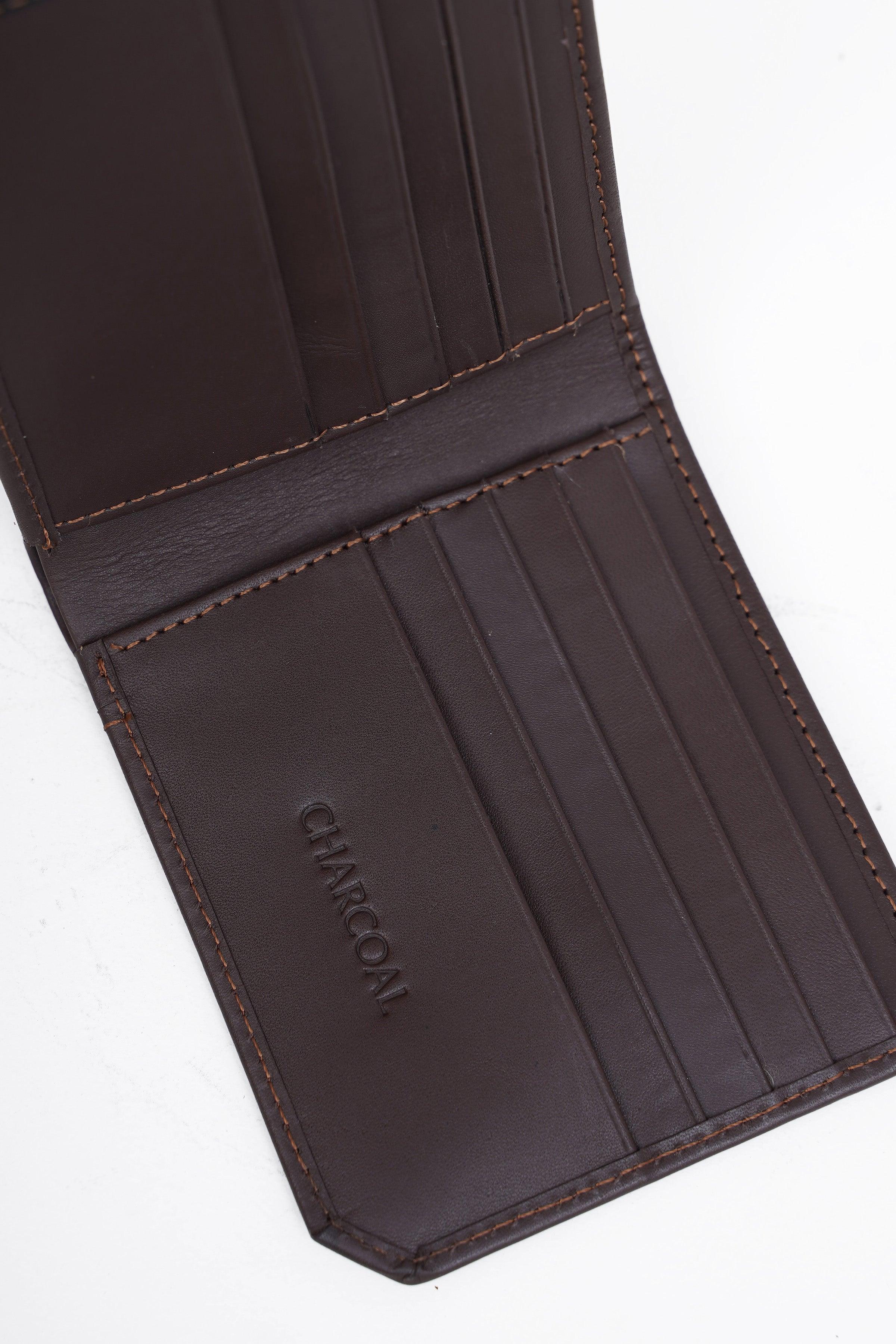 Brown leather wallet interior with card slots and stitched border