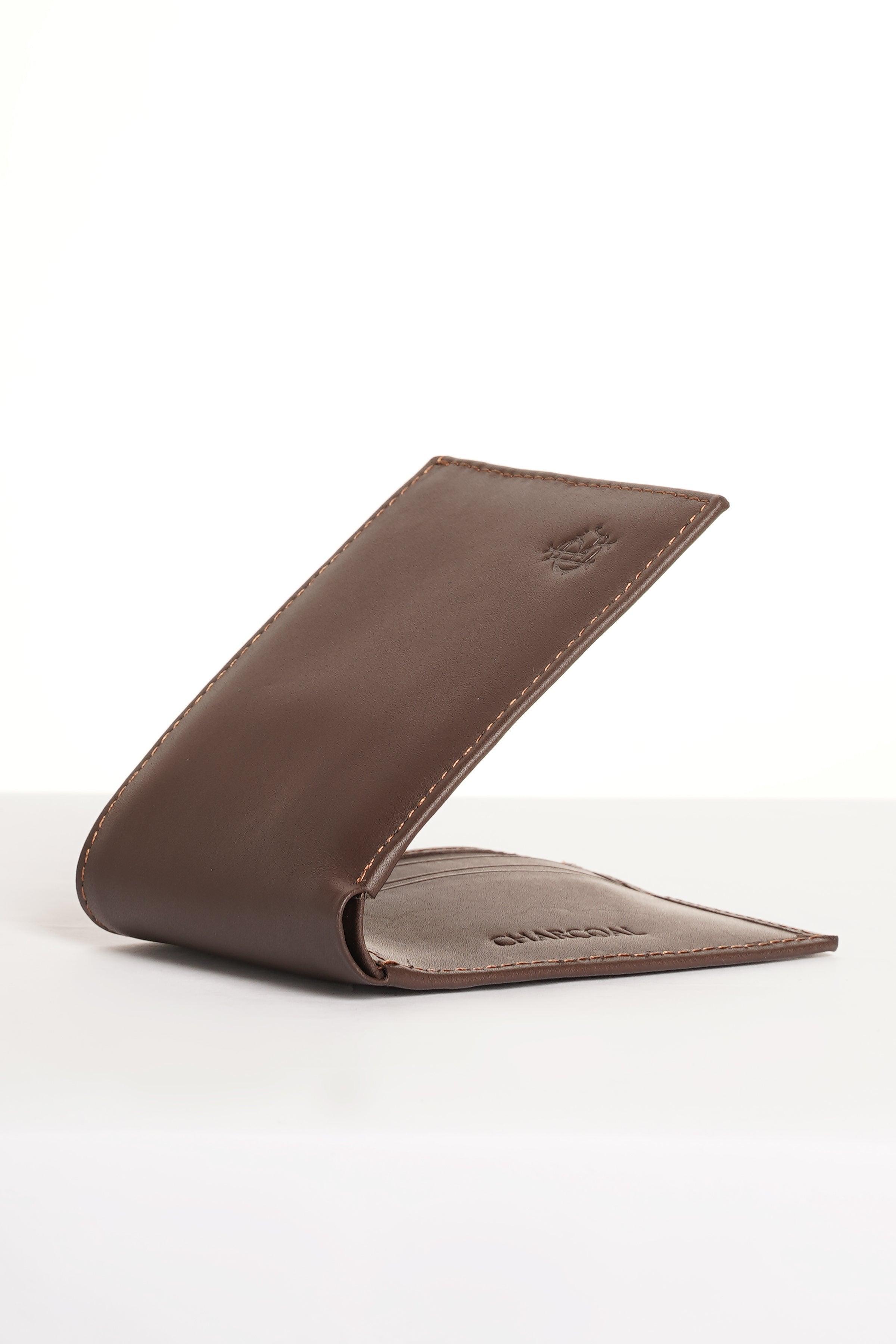 Brown leather slim wallet open, showing card slots