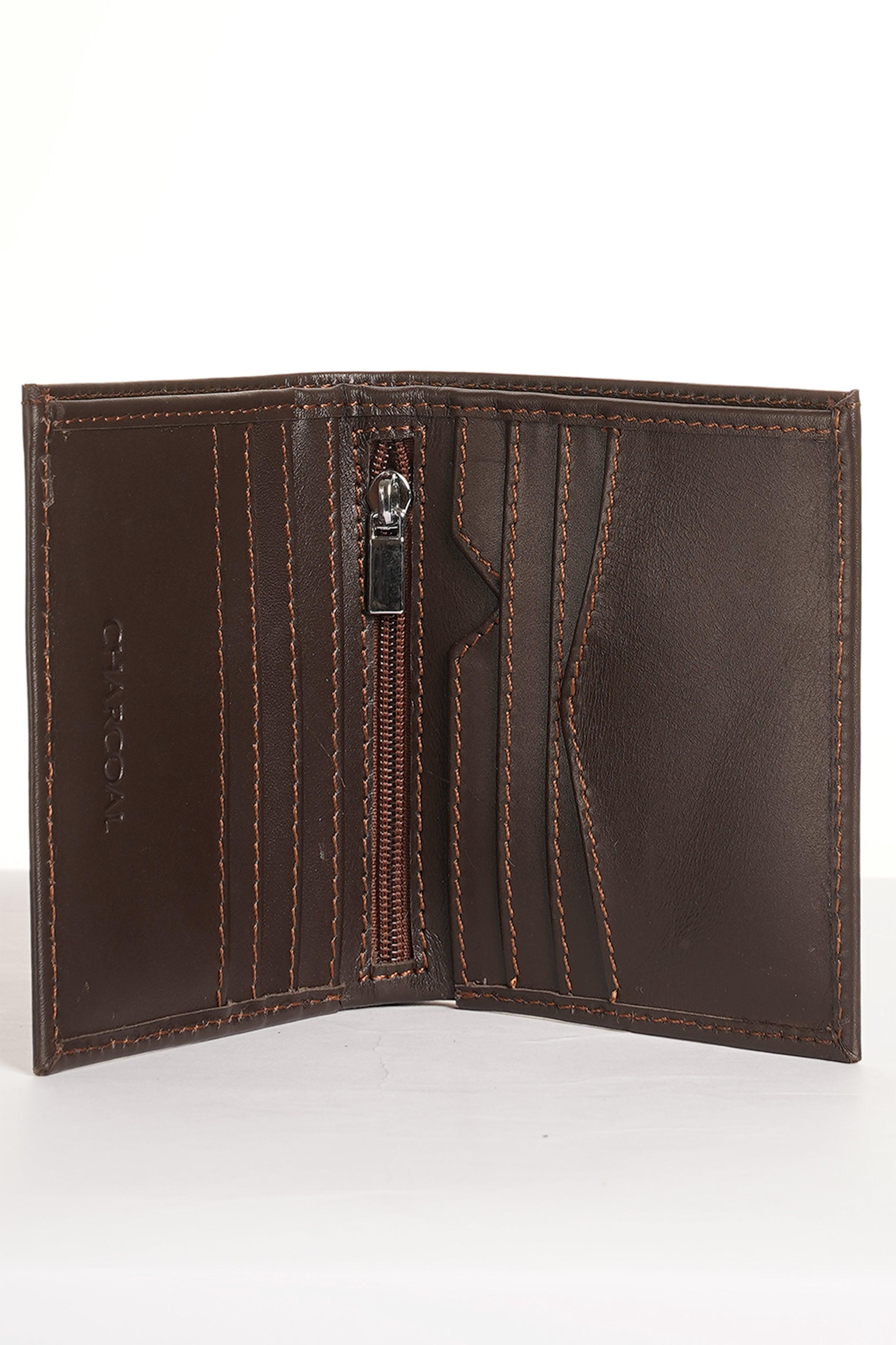 Brown leather bi-fold wallet showing interior with zipper pocket and seams