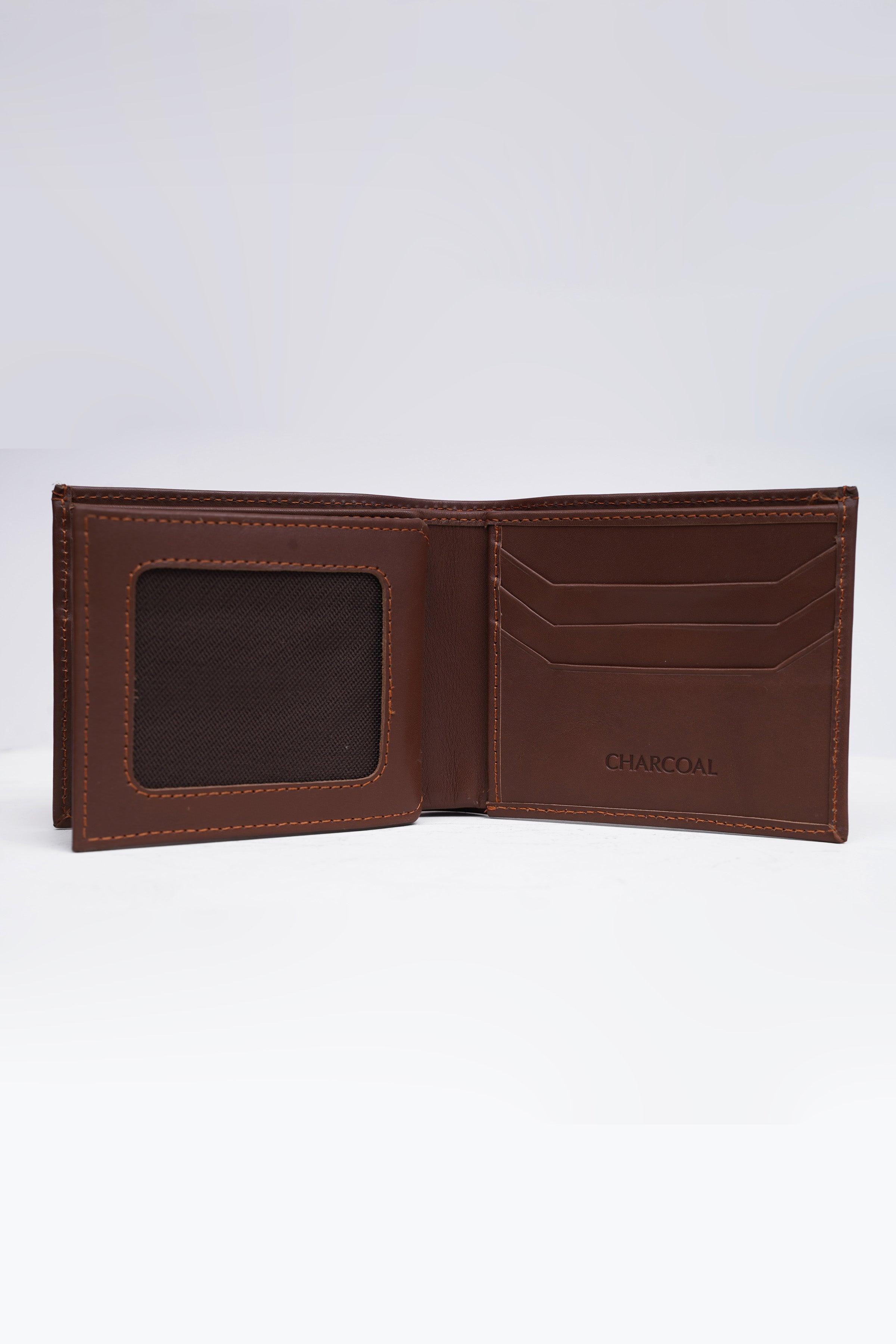 Tan leather wallet, open with card slots and interior panel detail
