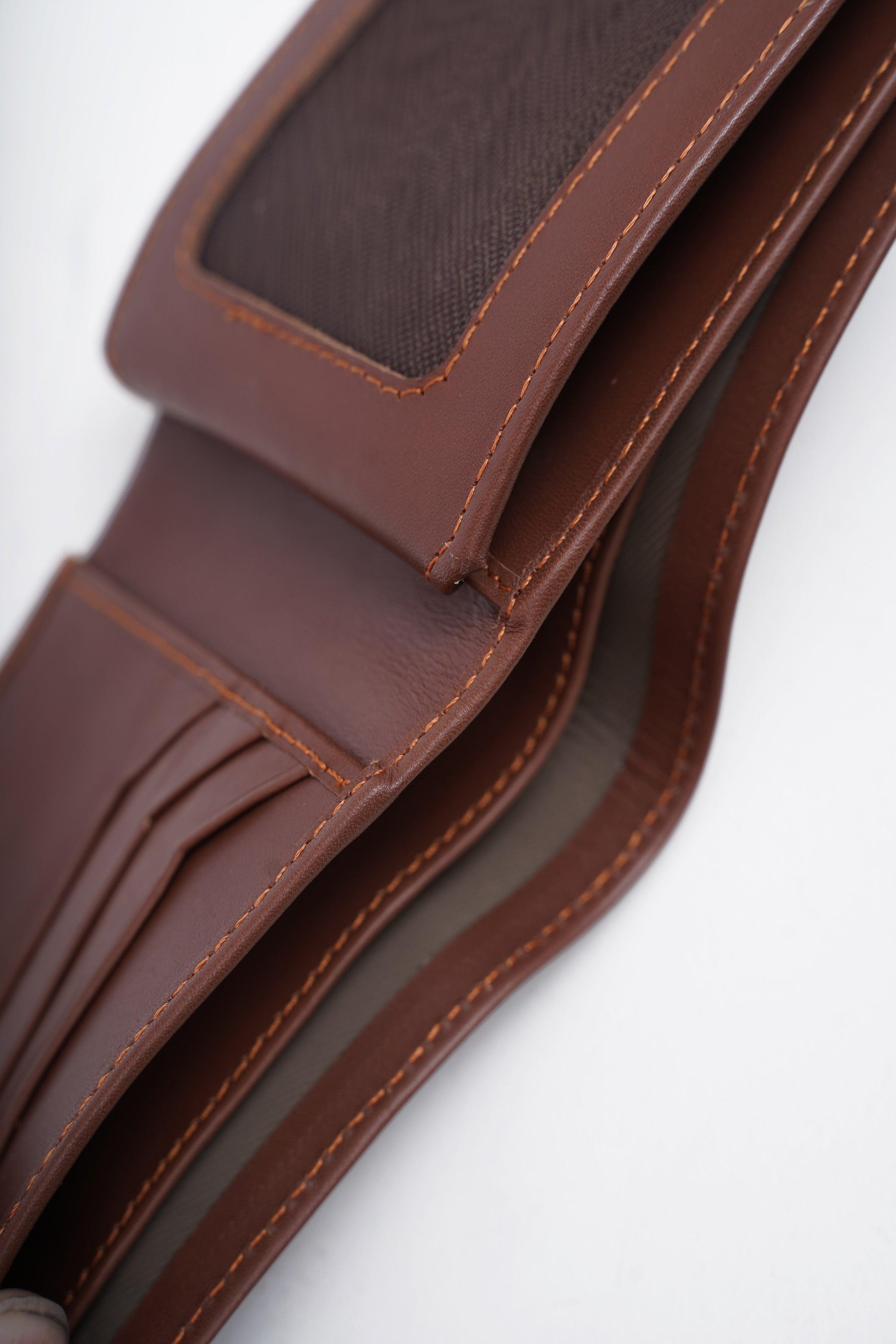 Tan leather wallet edge close-up with stitched lining and fold