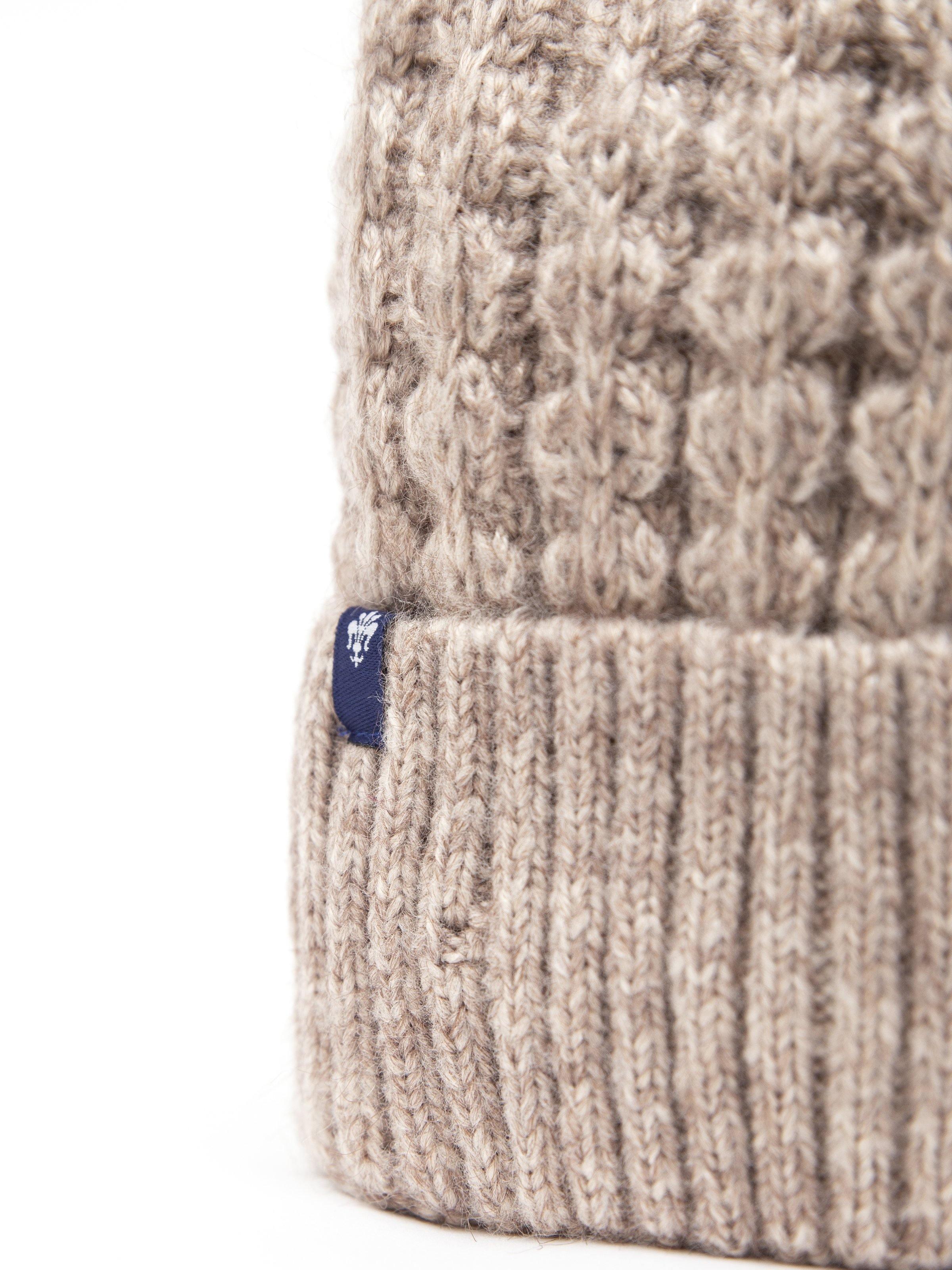 Knit beanie with ribbed cuff and blue logo patch, light taupe