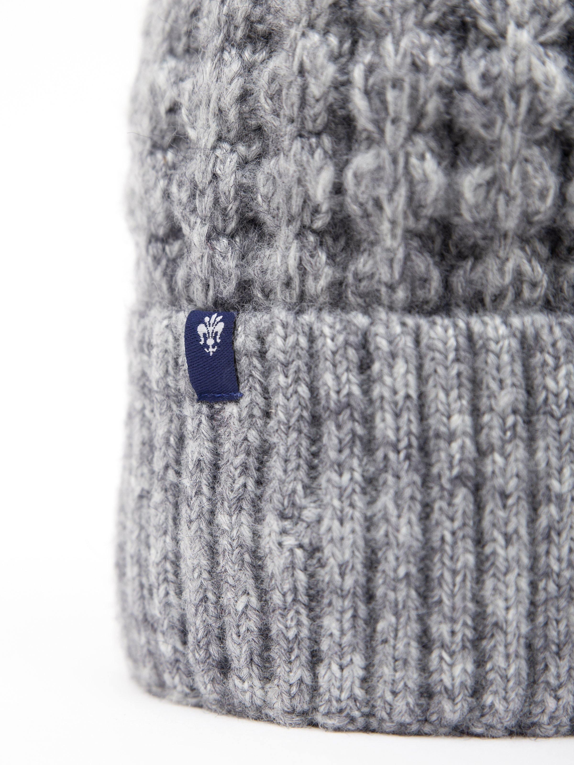 Gray wool beanie cap with ribbed cuff and small logo patch