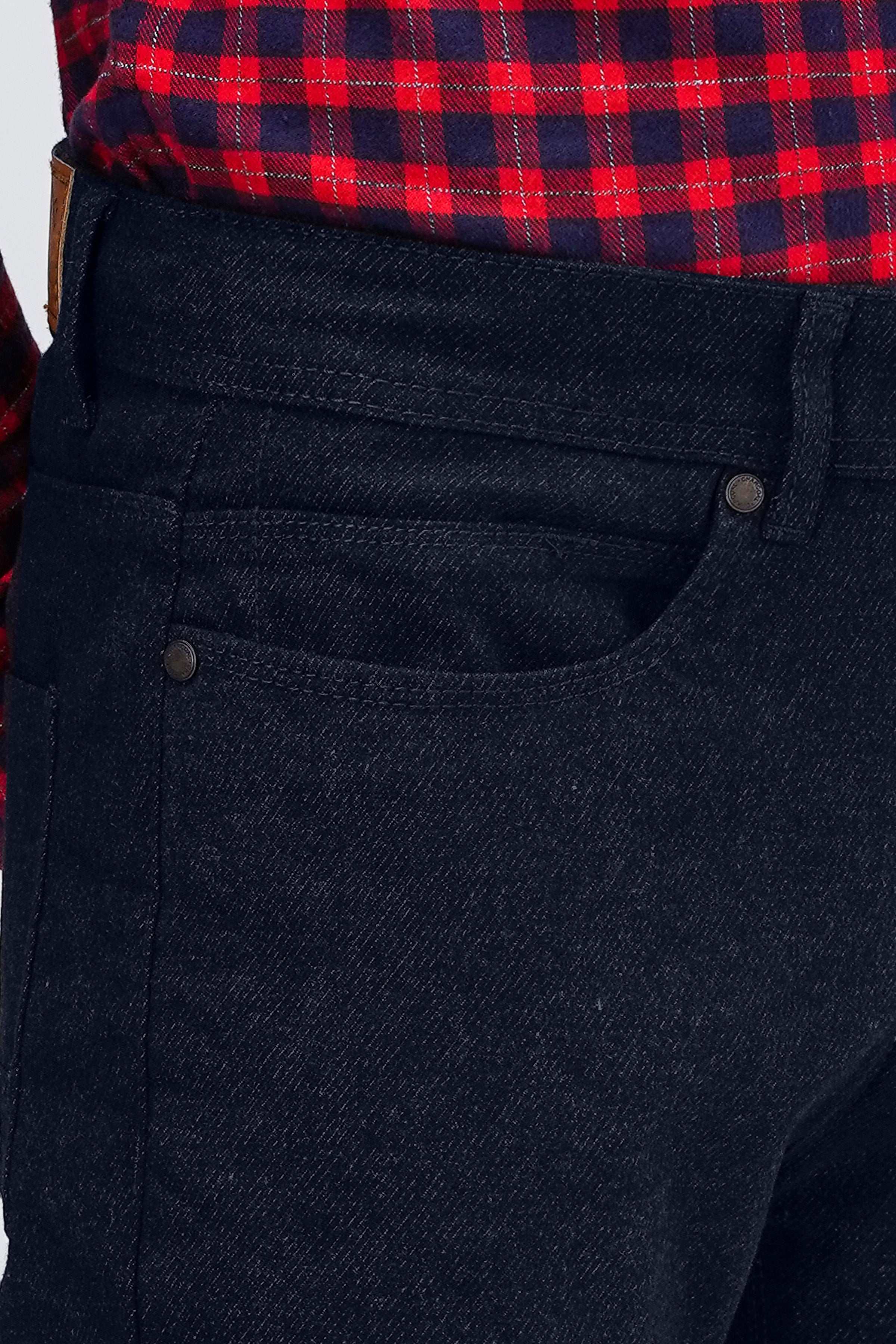 Navy woolen 5-pocket pants detail, front pocket with metal button