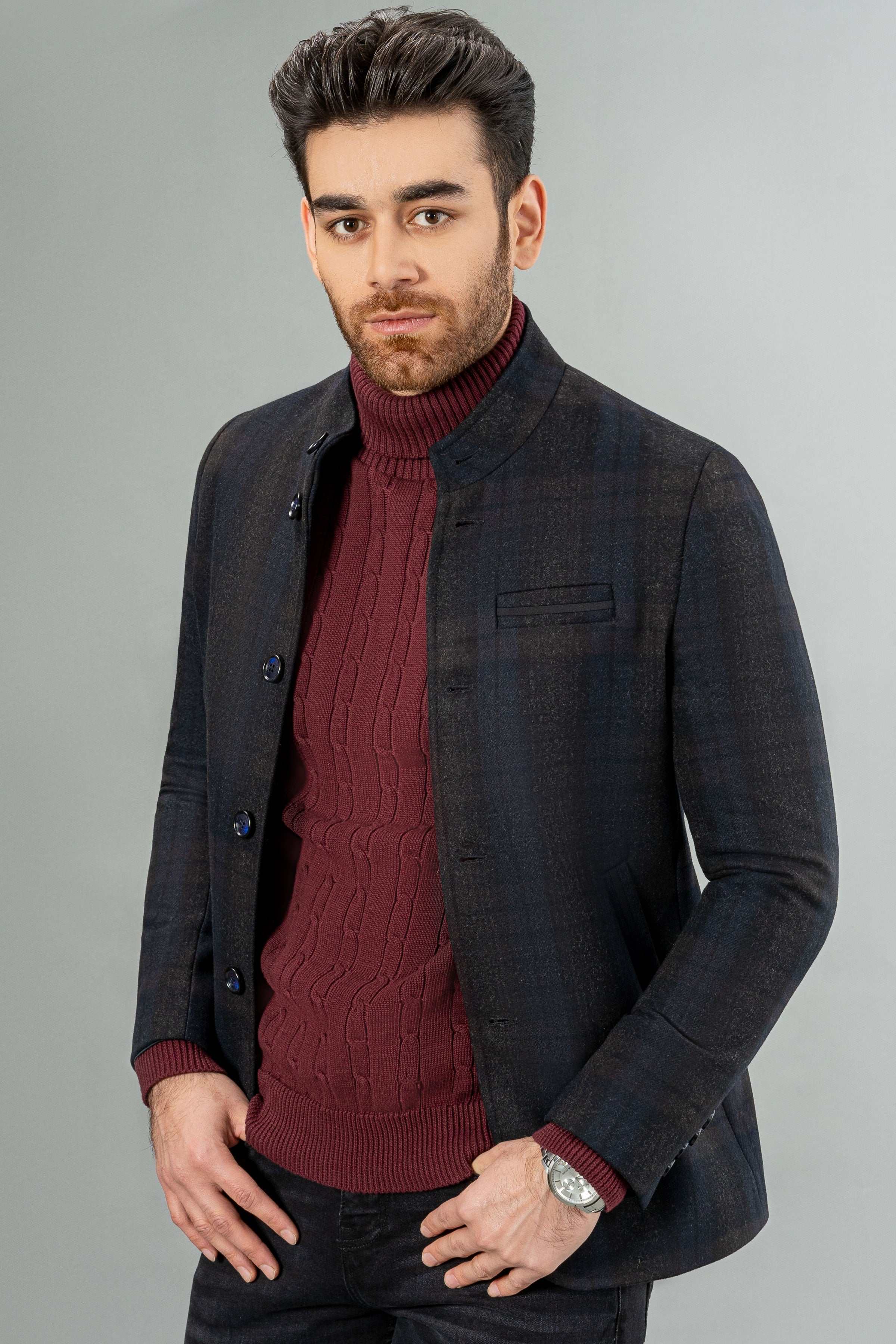 Dark wool casual coat with button front, chest pocket, flap side pockets, long sleeves