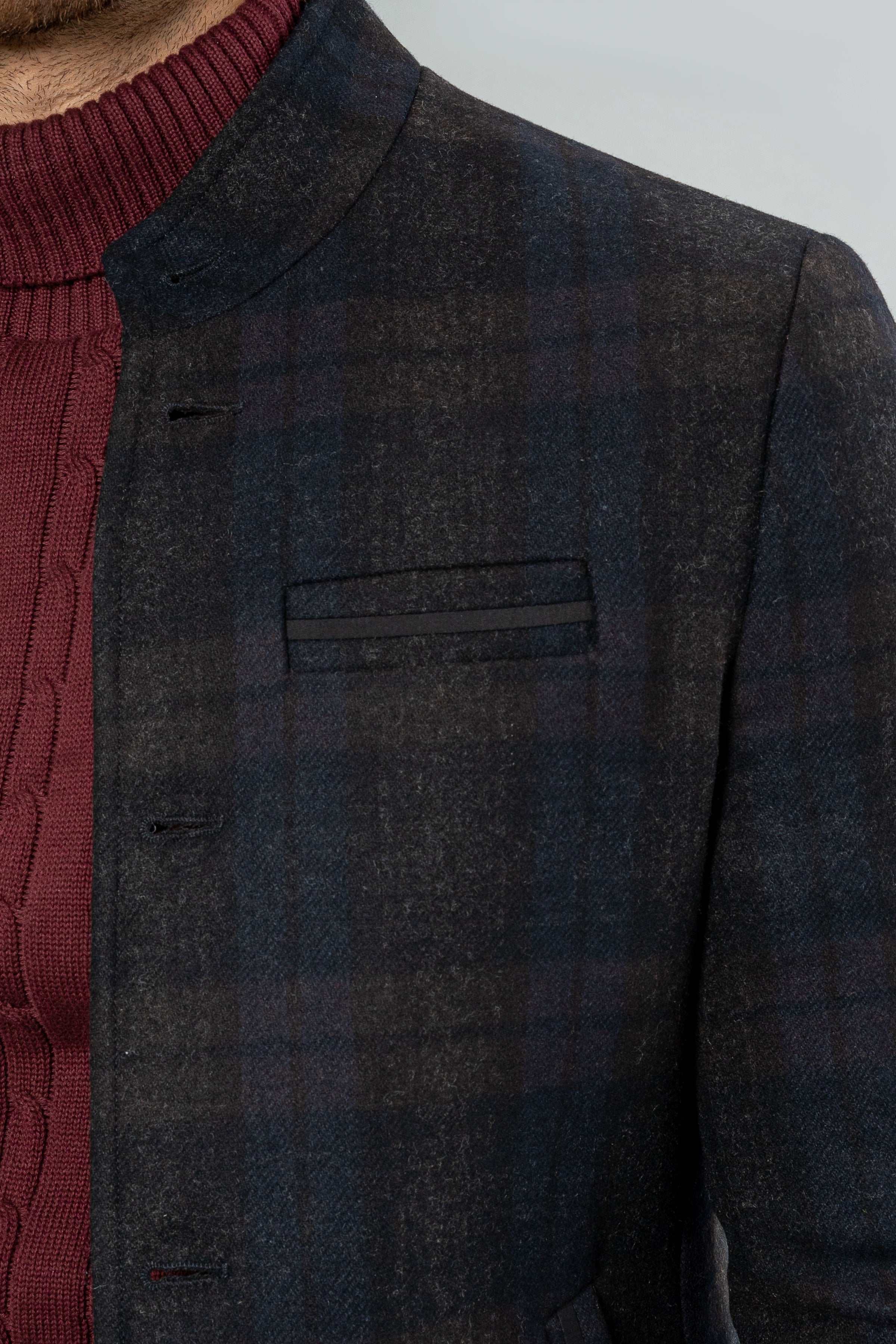 Dark wool casual coat closeup, notch lapel, chest pocket flap, button detail