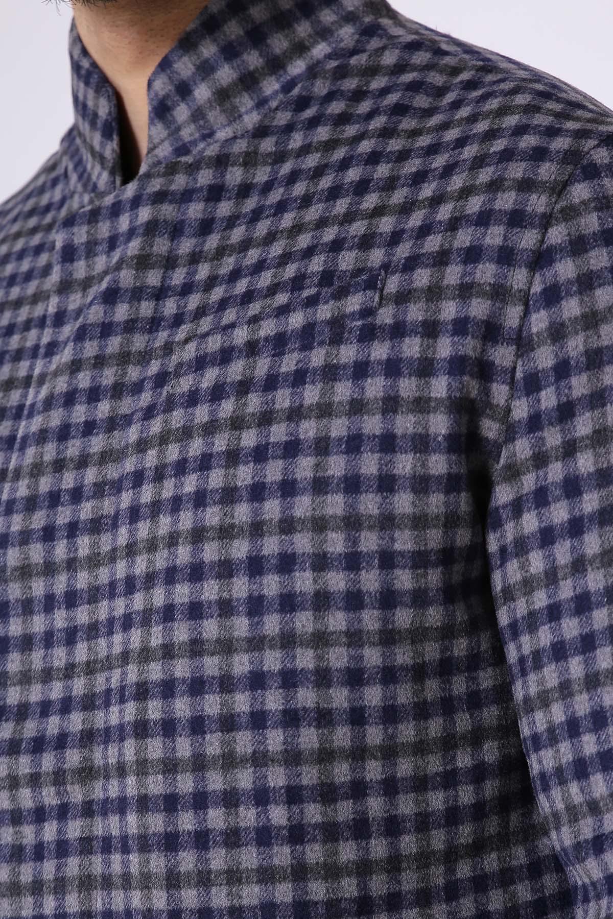 Woolen jacket fabric close-up, blue-gray check pattern with stand collar edge.