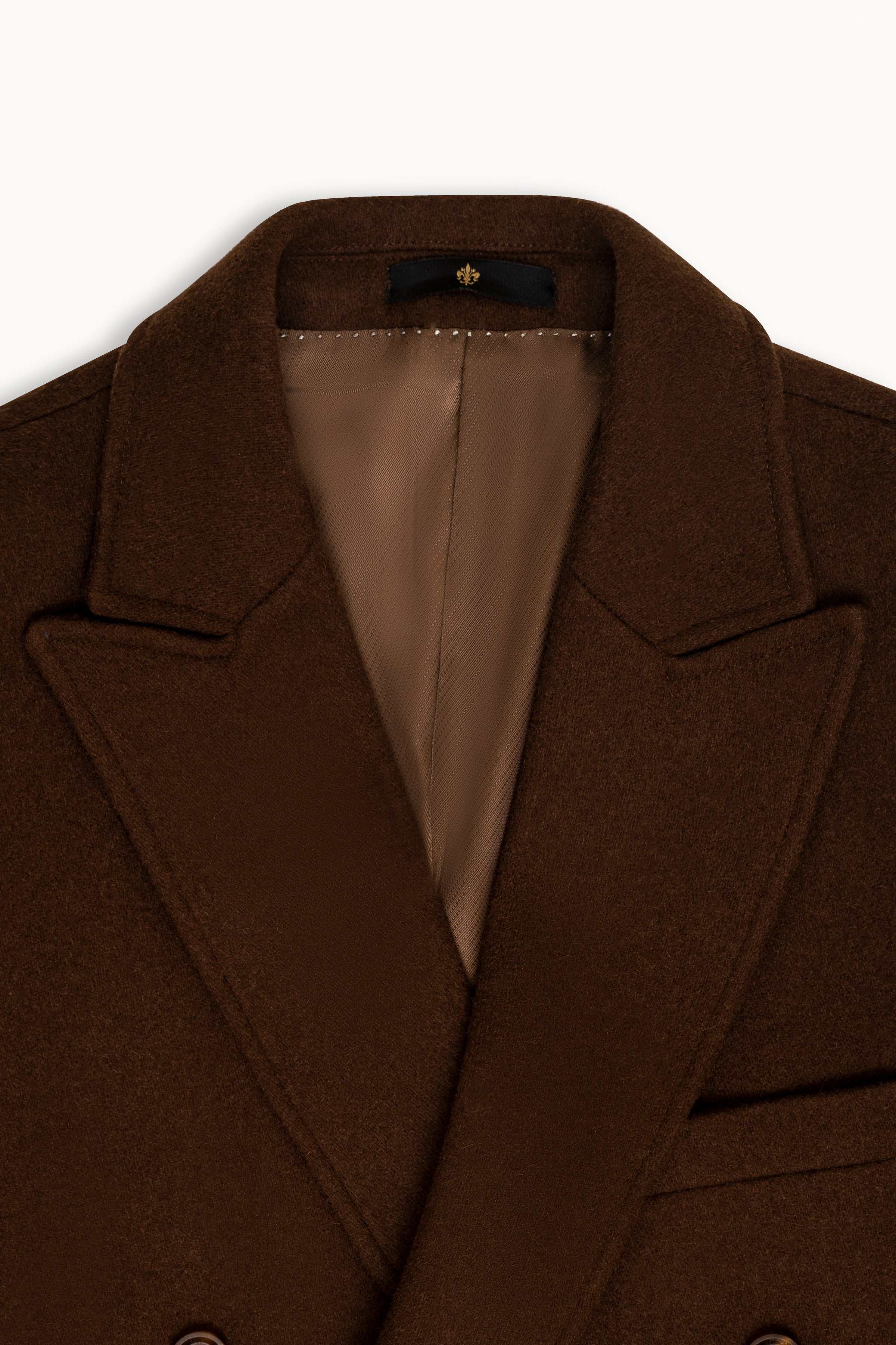 Dark brown wool coat close-up: notch lapels, double-breasted front, satin lining
