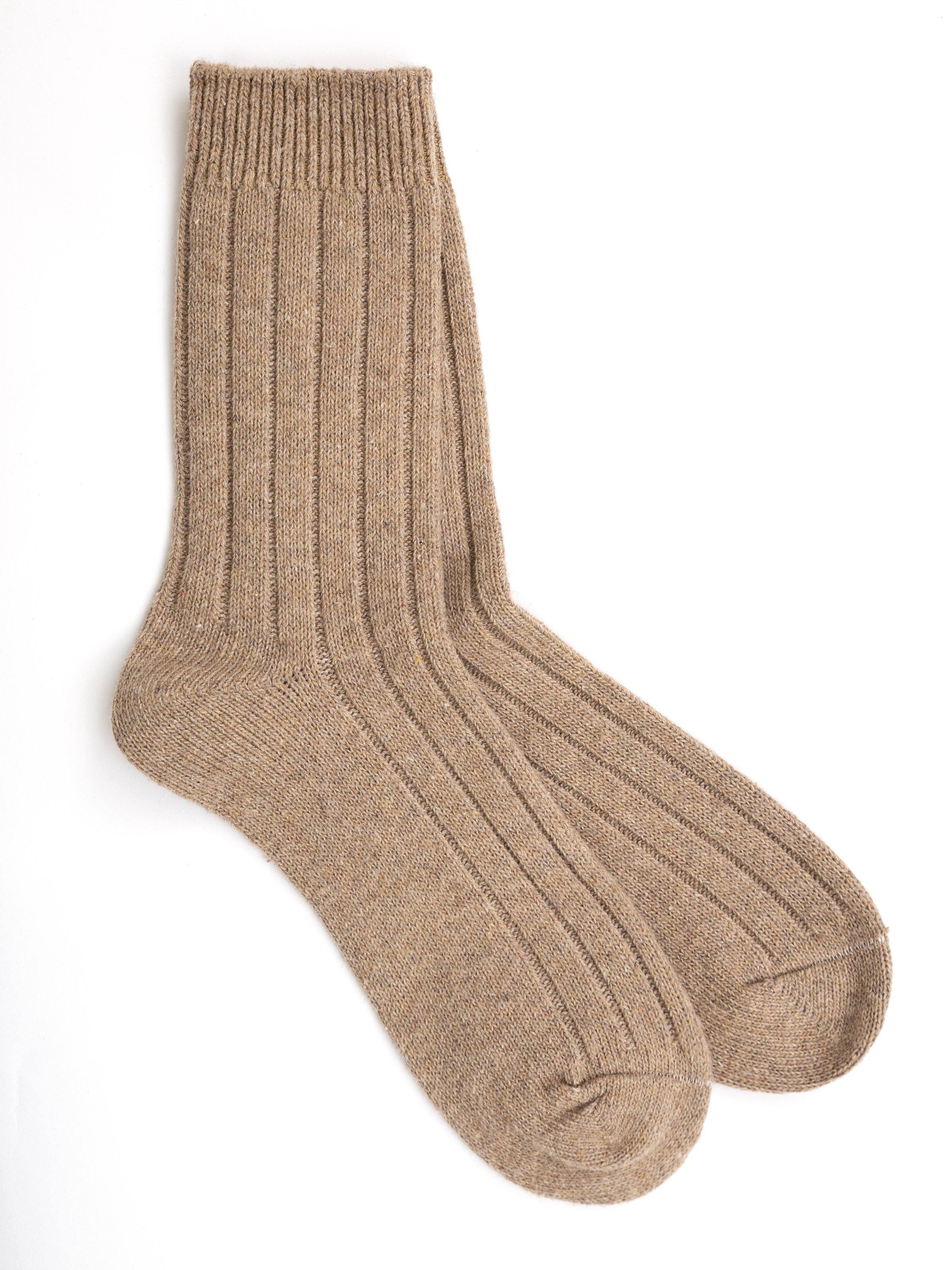 Woolen sock in beige tan, ribbed knit with vertical texture lines, crew height