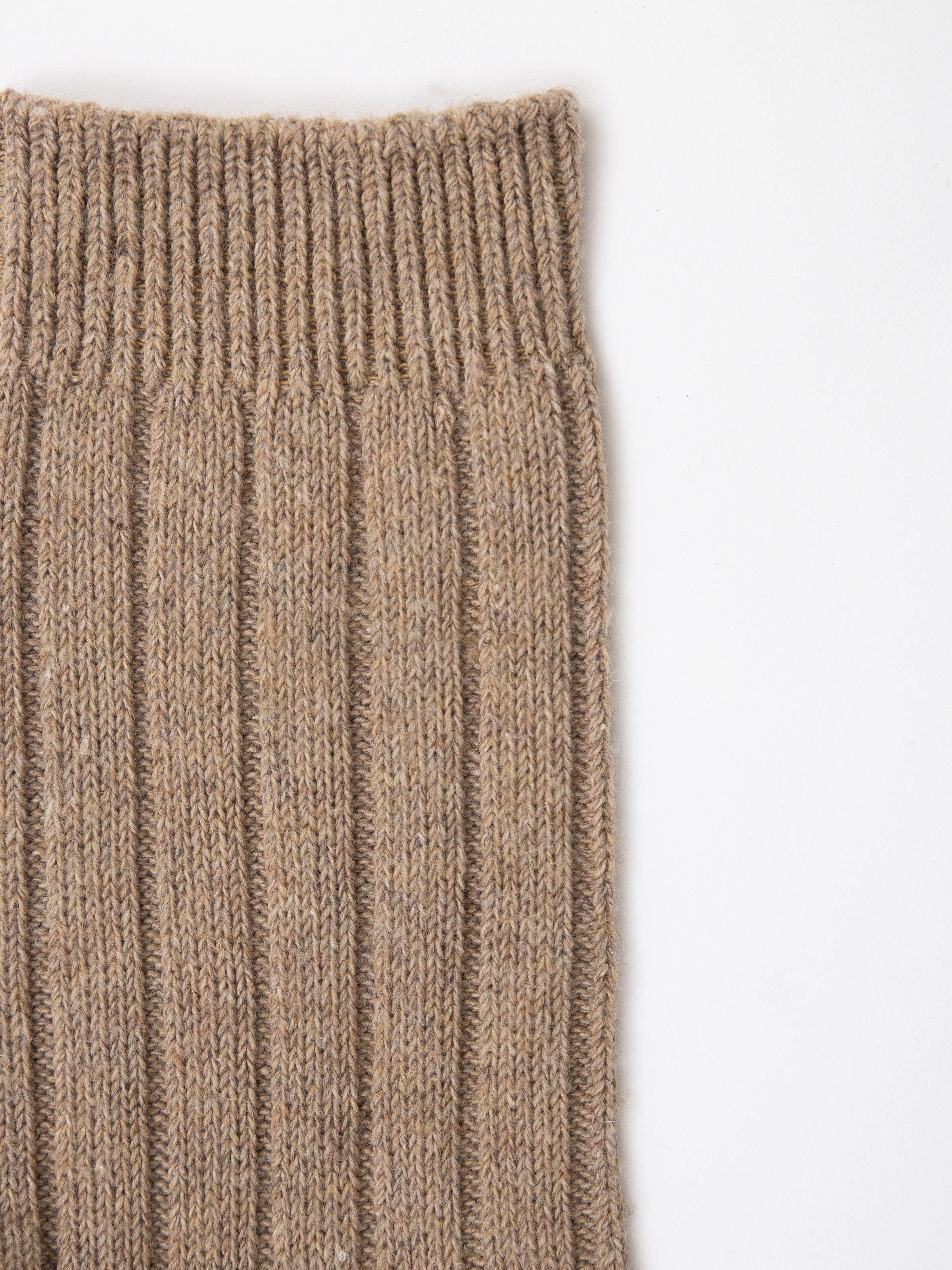 Ribbed knit sock cuff in beige tan, vertical ribbed texture detail