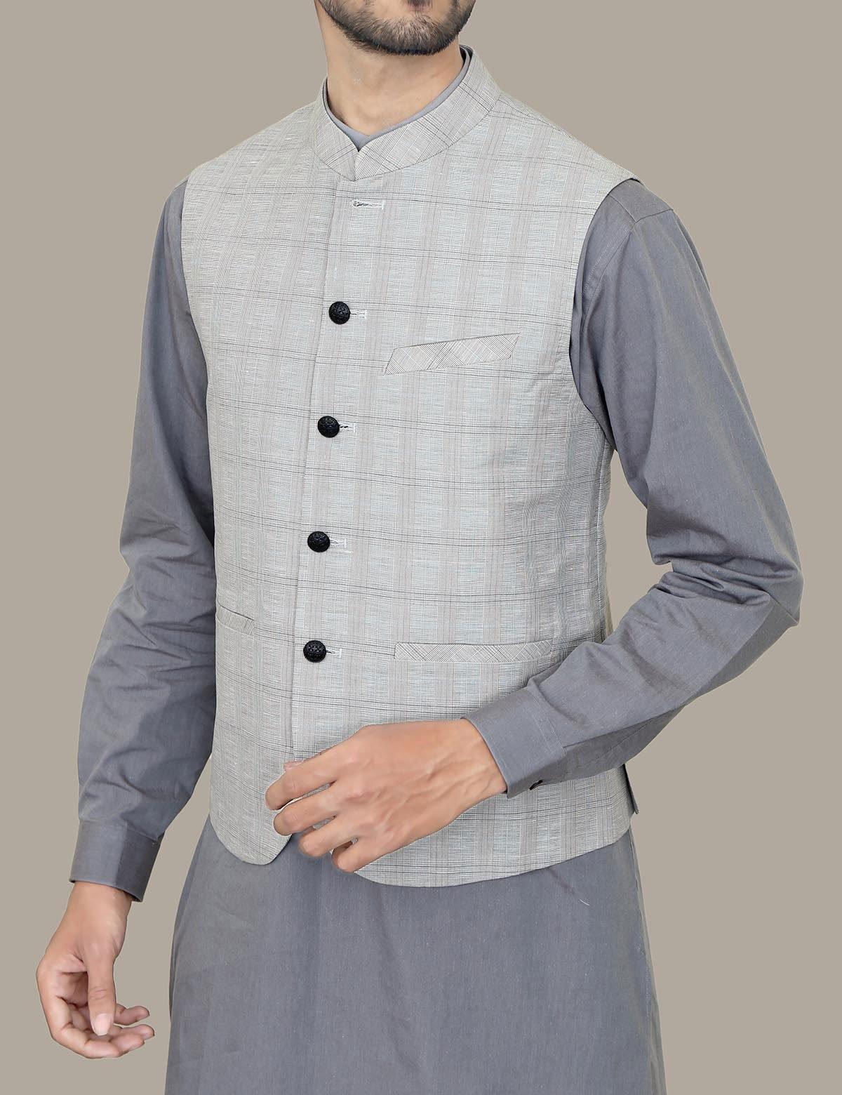 Smoke grey waistcoat with stand collar and four-button front, worn open over shirt.