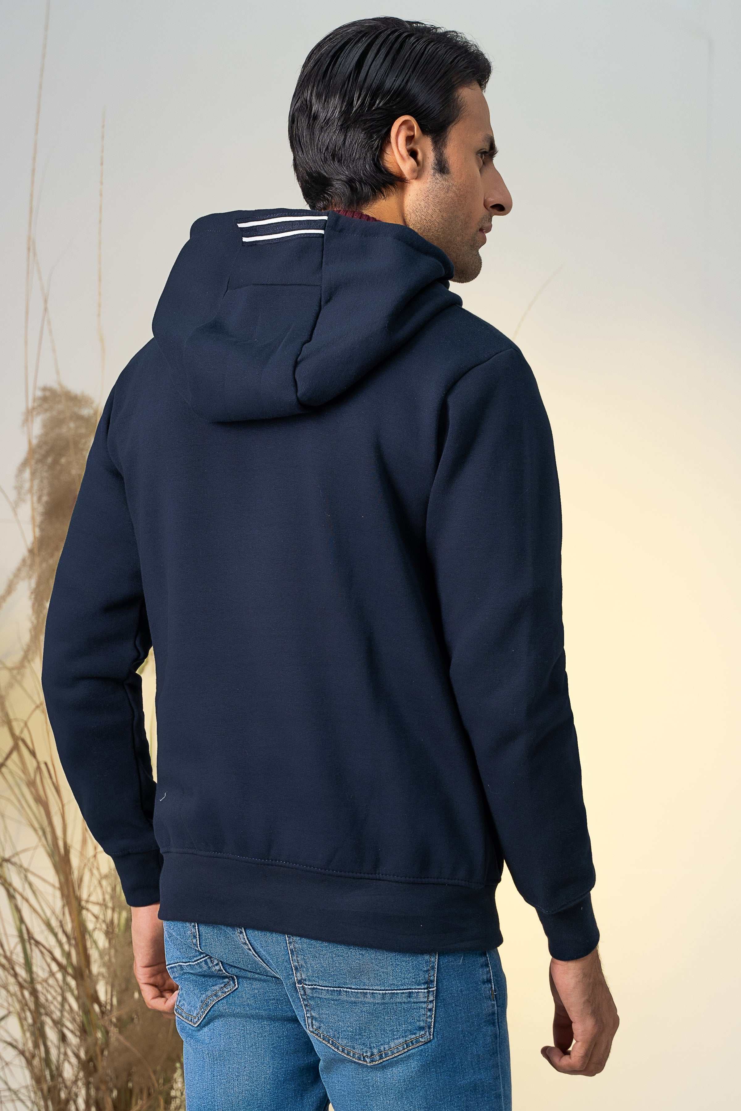 Navy zip-up hoodie with hood and long sleeves, back view