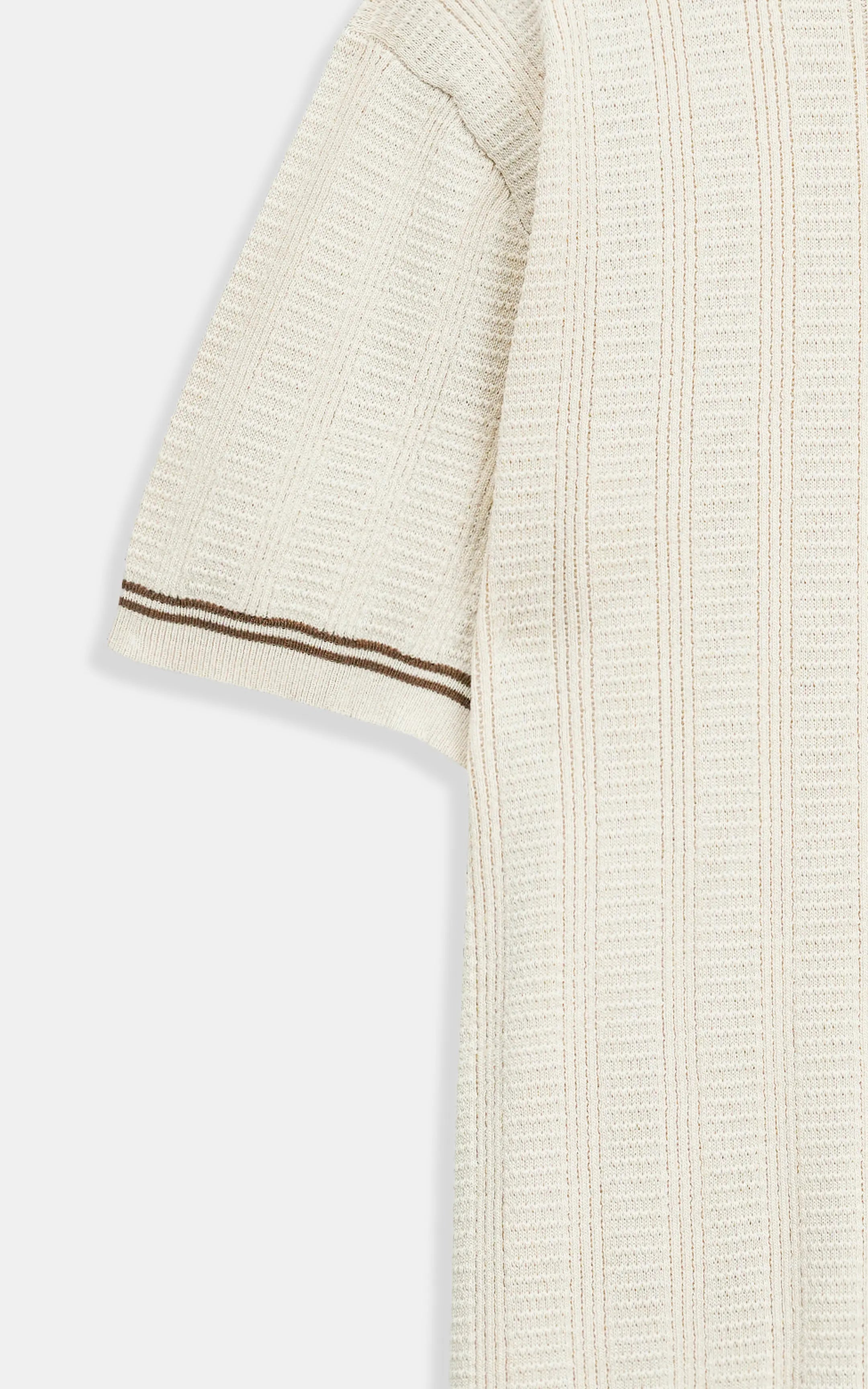 Beige cable-knit T-shirt sleeve with ribbed striped cuff trim, textured knit.