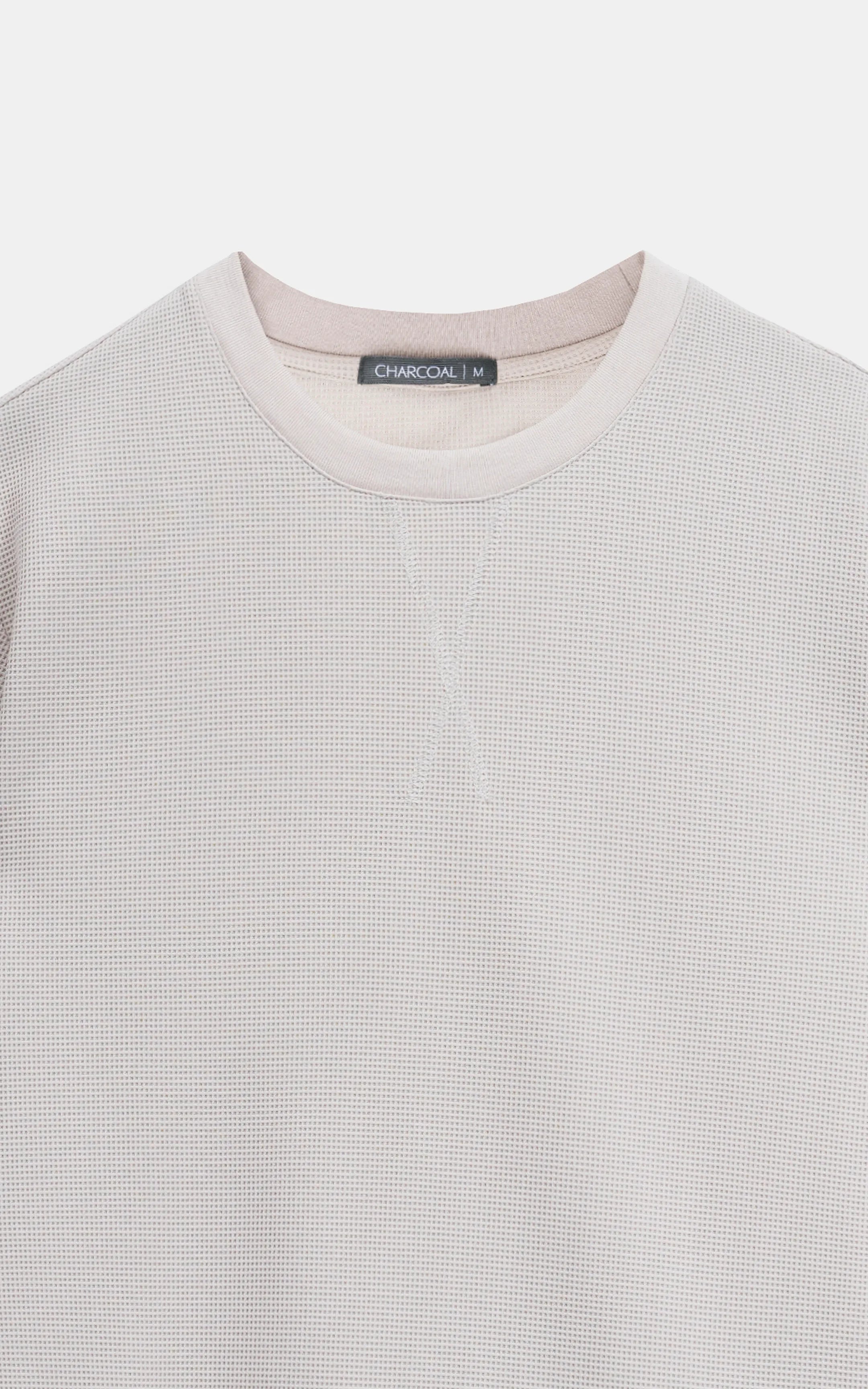 Light crew neck T-shirt with “CHARCOAL M” neck label and ribbed collar