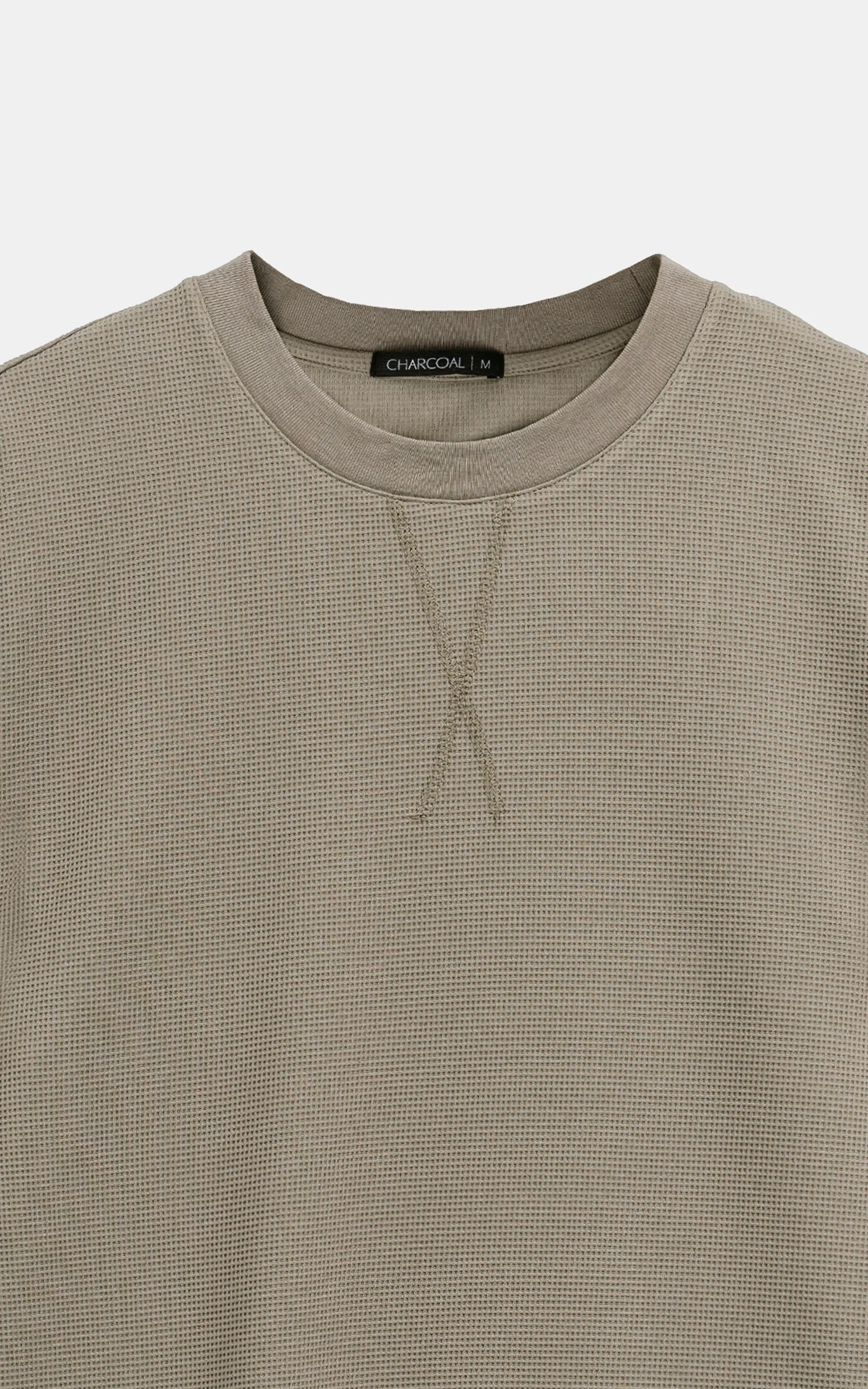 Muted green crew neck T-shirt with inside neck label and stitched neckline