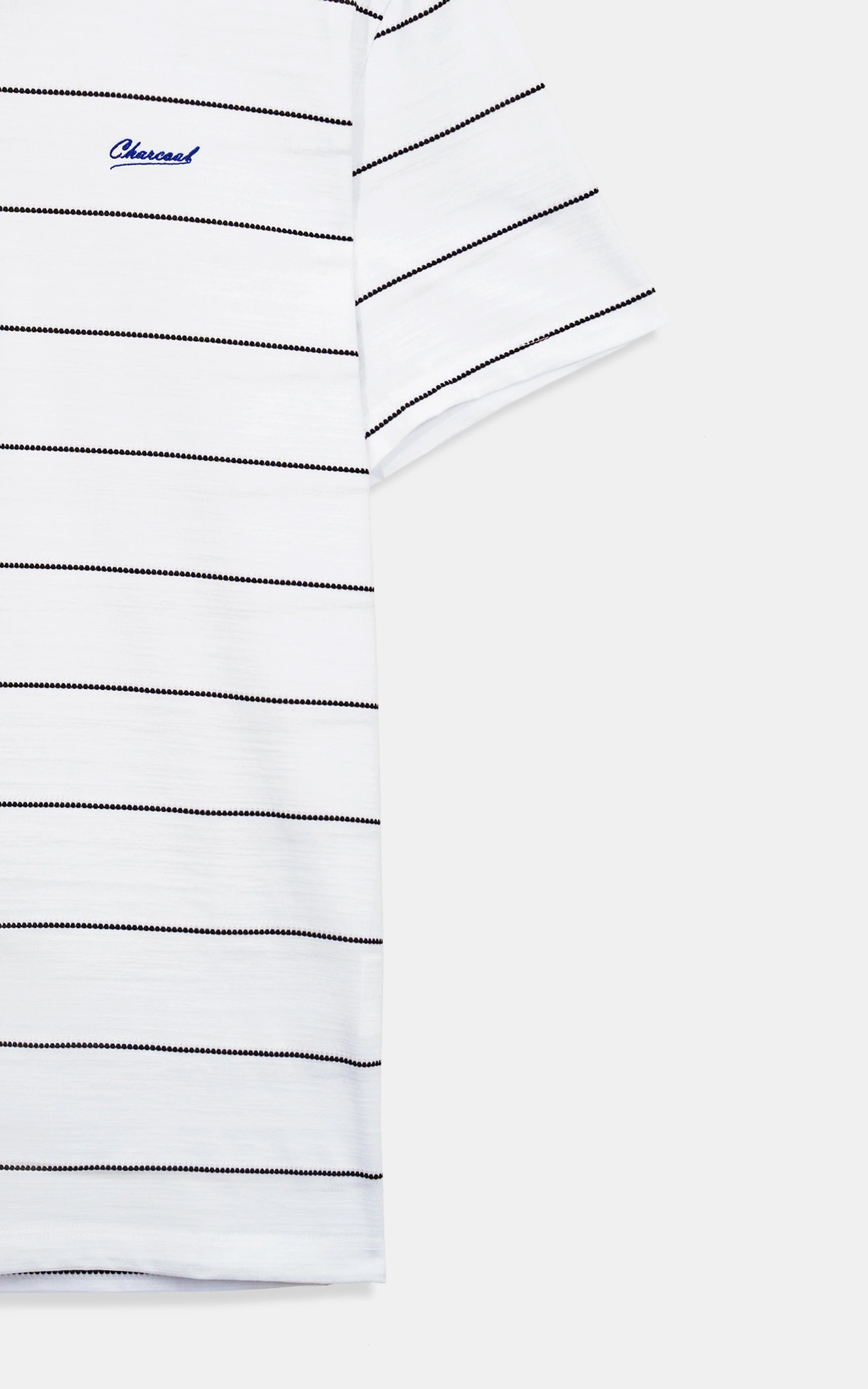 White polo shirt close-up with thin navy stripes and stitched edge